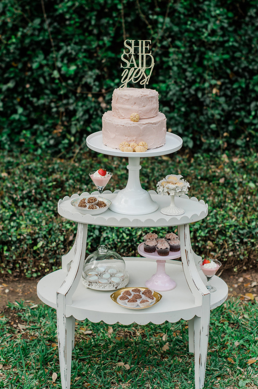  Super sweet dessert station with tiers and a cake with a She Said Yes Gold Lettered Cake Topper — Click to see 8 DIY Wedding Ideas for a Springtime Bridal Shower Brunch — Part of the 37 Creative DIY Wedding Ideas for Spring as seen on www.BrendasWed