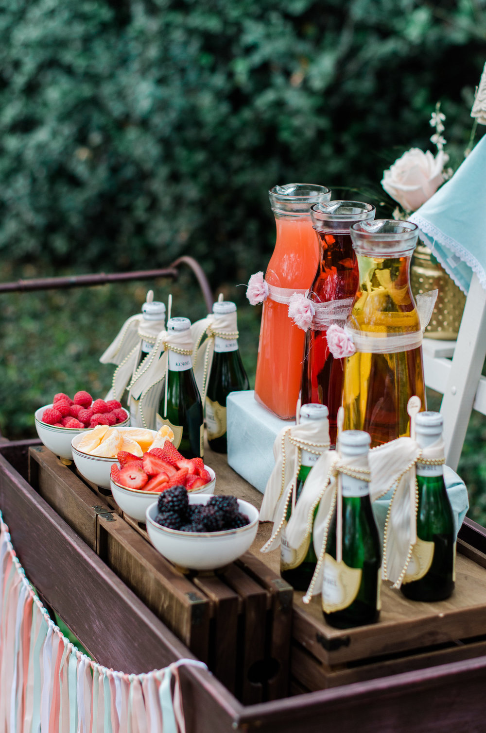  Beautiful Mimosa Station set up on a darling vintage serving cart with fresh berries — Click to see 8 DIY Wedding Ideas for a Springtime Bridal Shower Brunch — Part of the 37 Creative DIY Wedding Ideas for Spring as seen on www.BrendasWeddingBlog.co