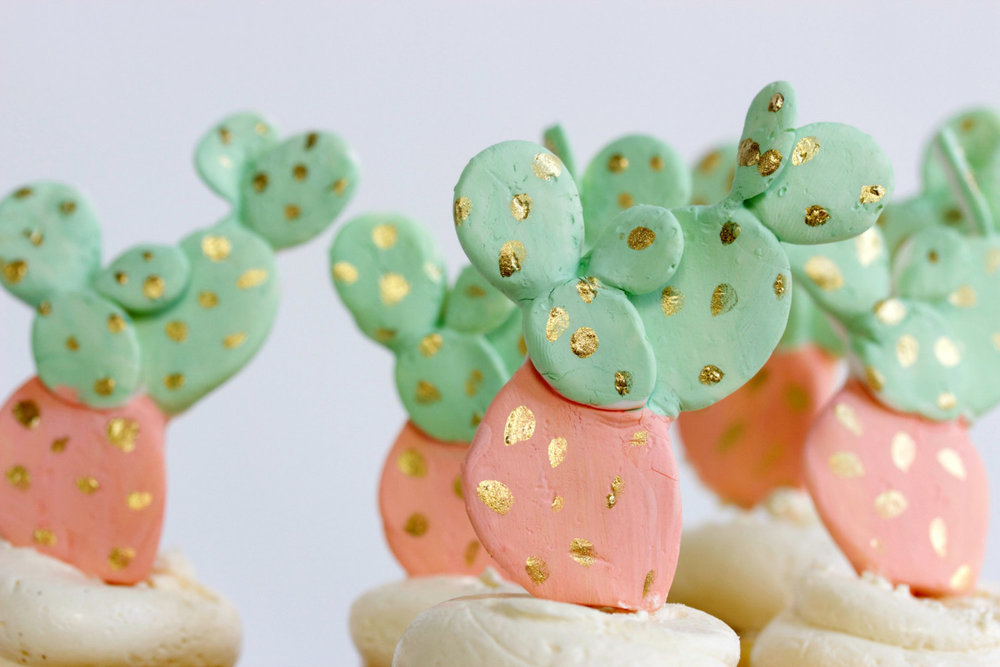  Top your wedding cake or cupcakes with edible fondant cactus toppers. As seen in Cactus Wedding Ideas - a hot wedding trend on www.BrendasWeddingBlog.com 