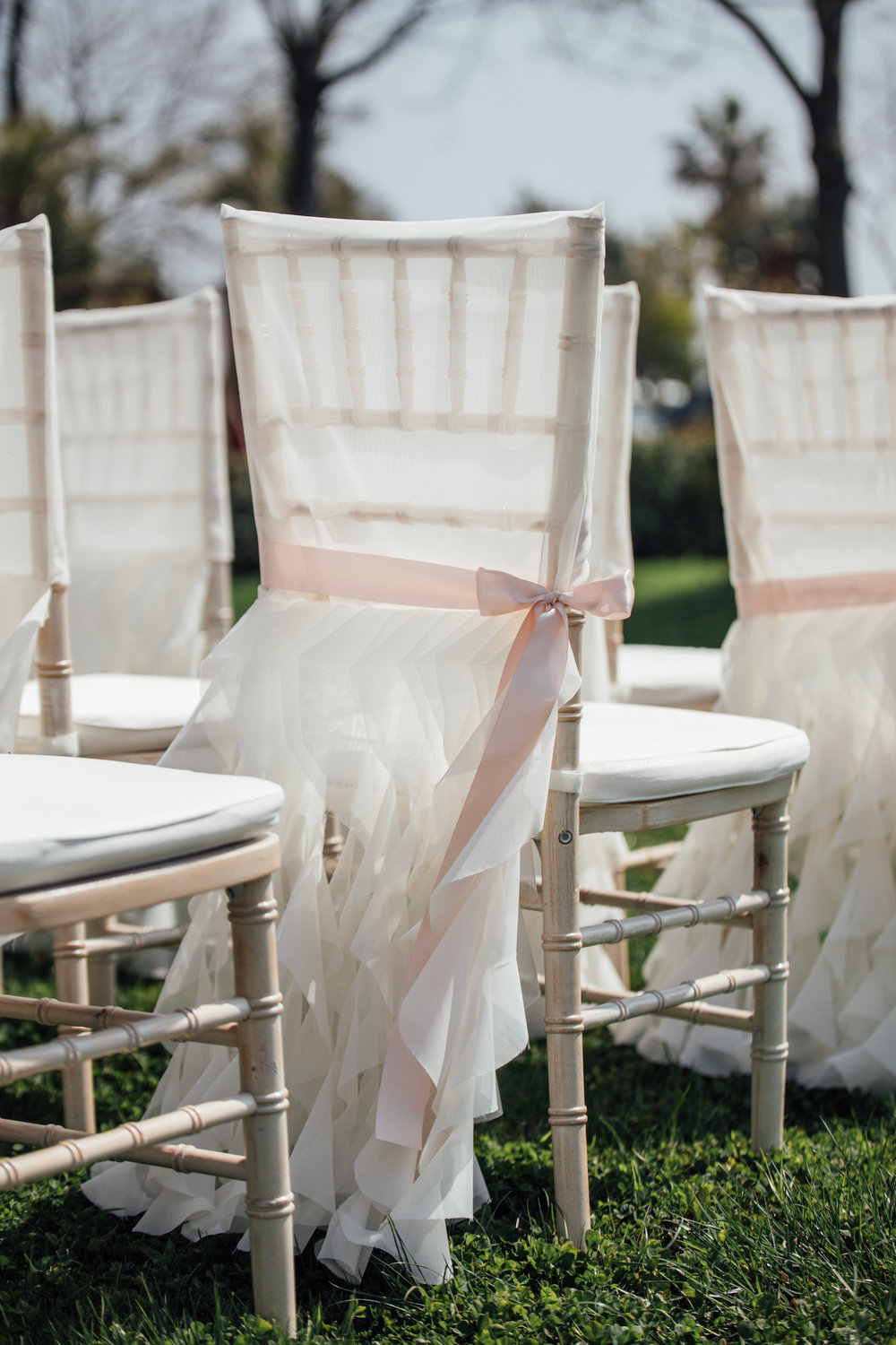  Pretty ruffled chair covers tied with ribbon from a Lemon Yellow Garden Wedding Styled Shoot in Rome Italy - by Jess Palatucci Photography - as seen on www.BrendasWeddingBlog.com 