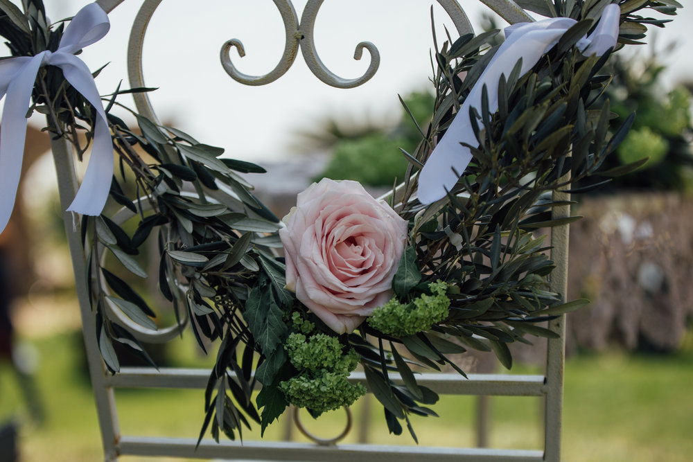  Lush greenery chair swag with a rose from a Lemon Yellow Garden Wedding Styled Shoot in Rome Italy - by Jess Palatucci Photography - as seen on www.BrendasWeddingBlog.com 