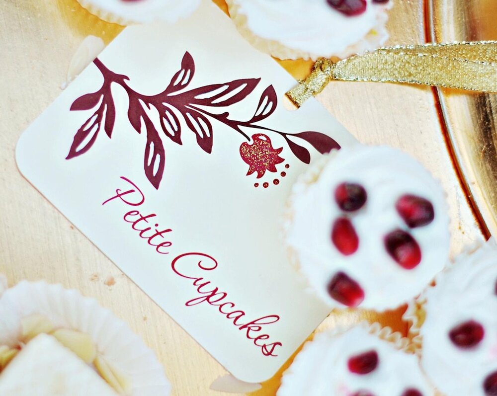  Glitter embellished pomegranate wedding dessert cards from Festive Fetti. As seen on Brenda’s Wedding Blog post that’s all about wedding centerpieces with an unexpected fruit - pomegranates. See more at www.brendasweddingblog.com 