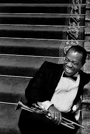 Louis Armstrong songs are known for their relaxed feel and great horn solos, as shown by Louis in this picture