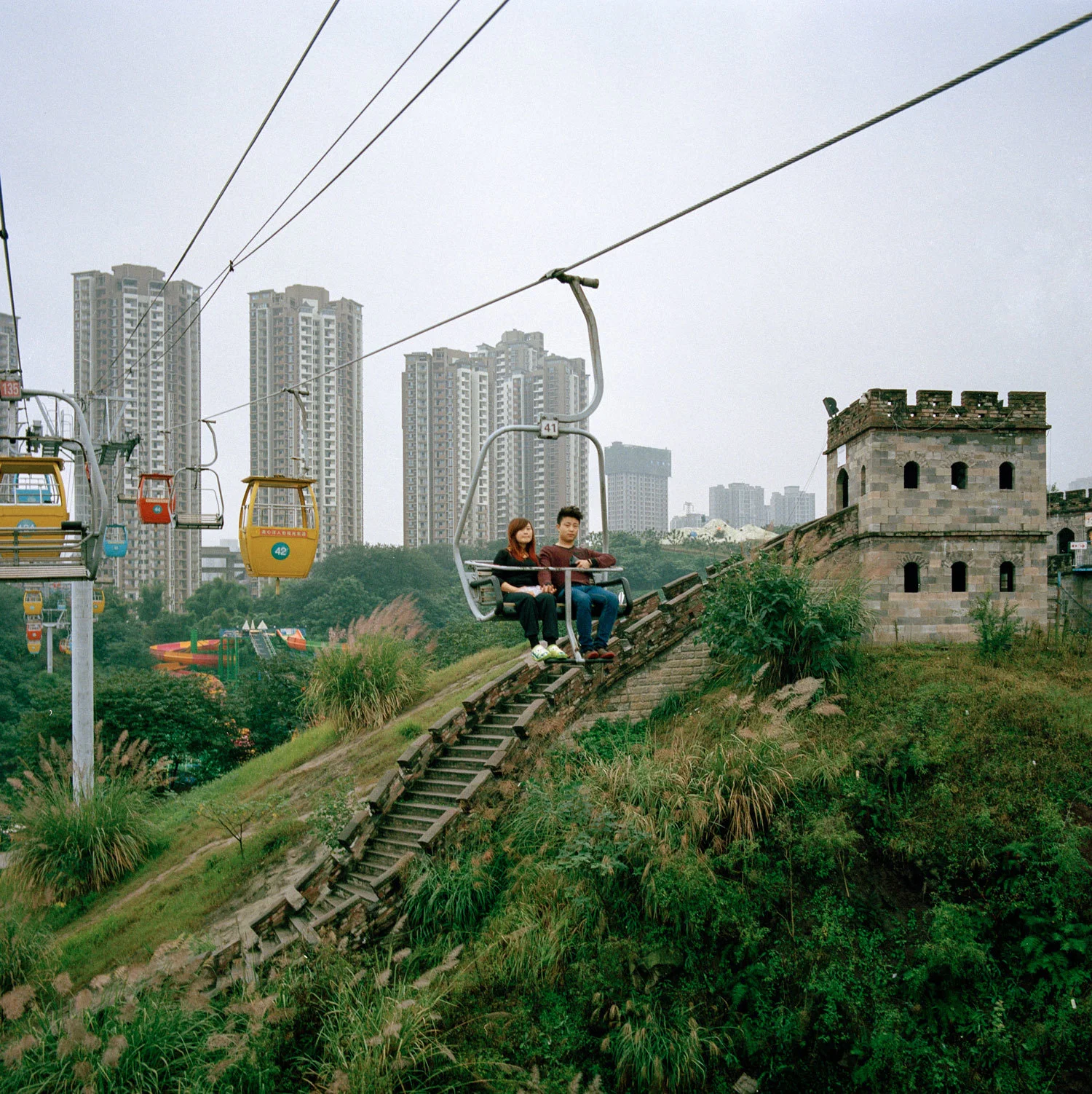 A couple enjoying a ride in the Foreign Street Amusement park in Chongqing