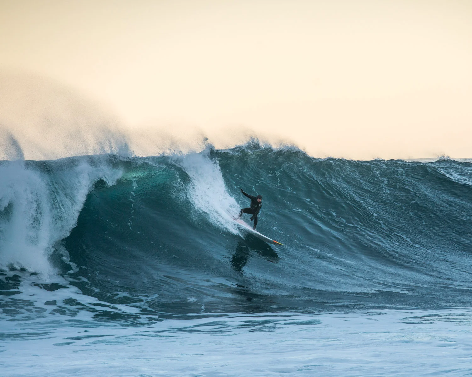 A local Lofoten based teacher enjoy the big swell coming from Iceland to spend an afternoon surfing in Unstad