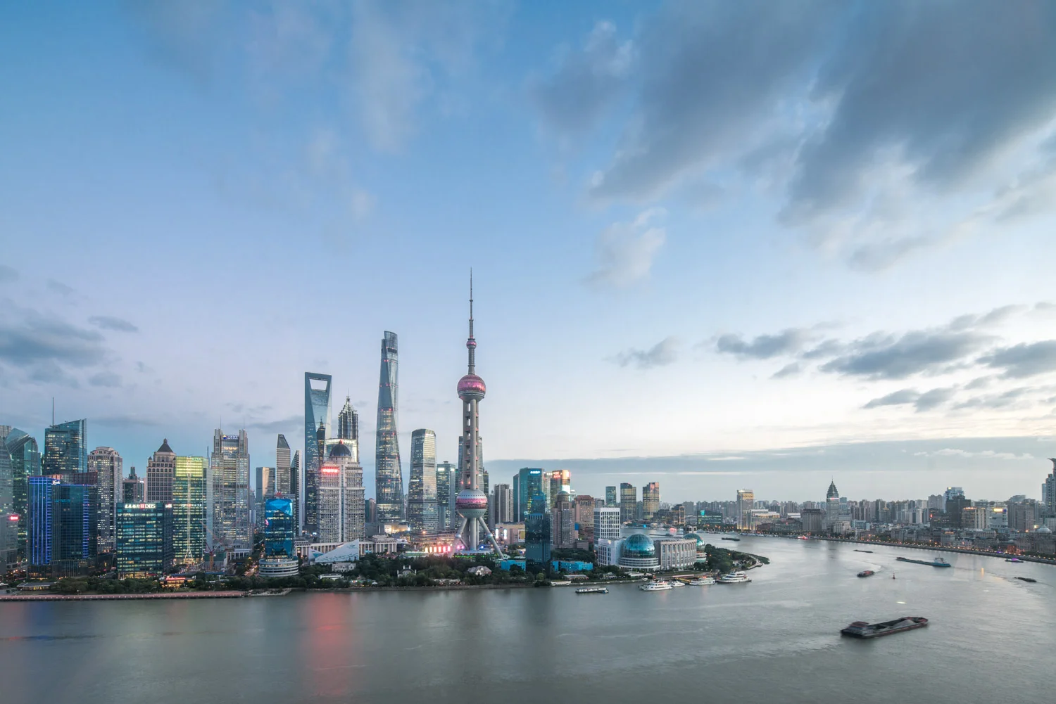 The Pudong Lujiazui CBD view from Puxi in shanghai with some of the highest towers in East Asia includinng the Shanghai tower, the pearl tower, the financial center and the Jinmao tower
