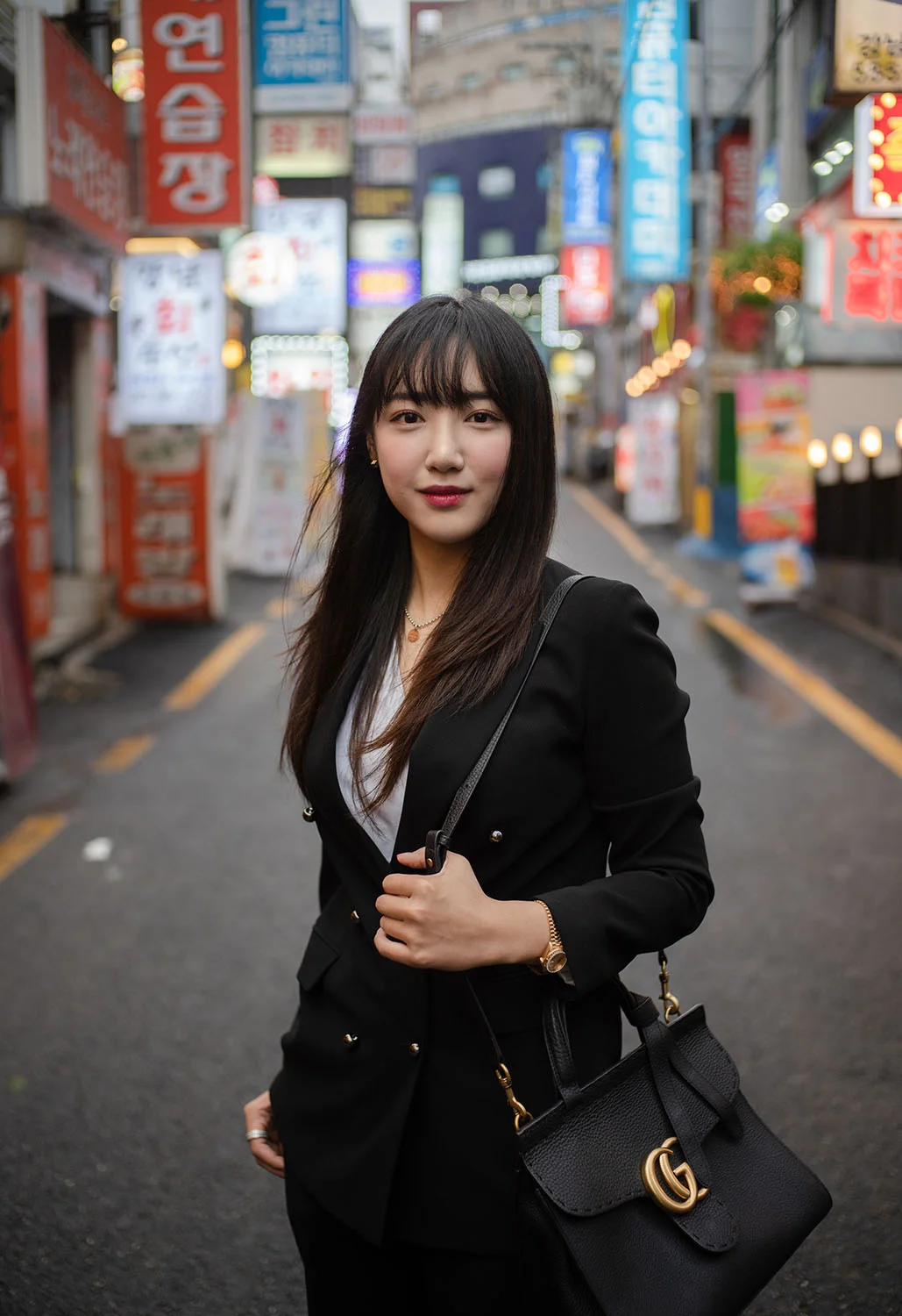 Sara Kim posing in a backstreet of the Gangnam district in Seoul. Tim Franco for the New York Times.