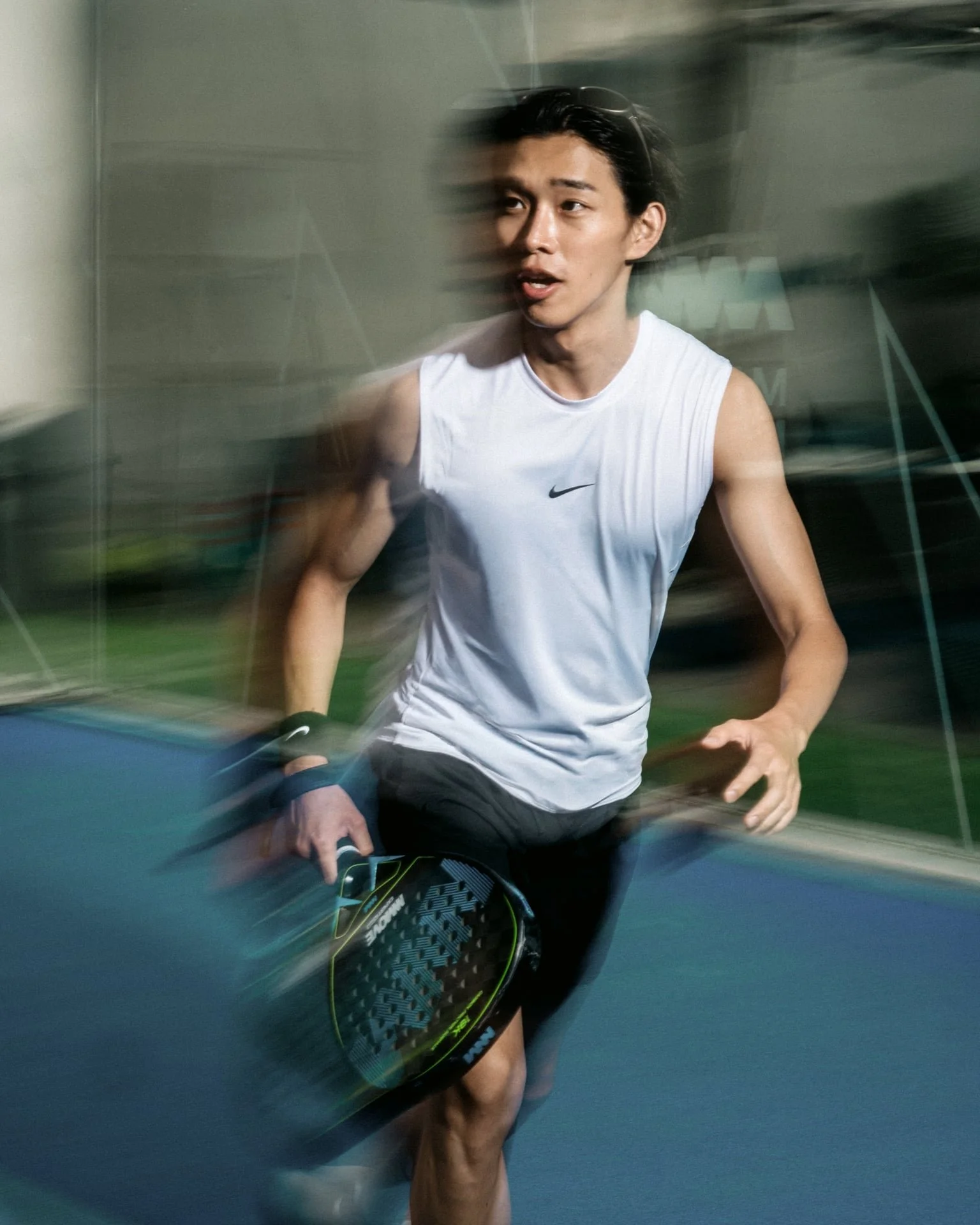 Sport action photographer Seoul Korea — padel player motion blur outdoor court