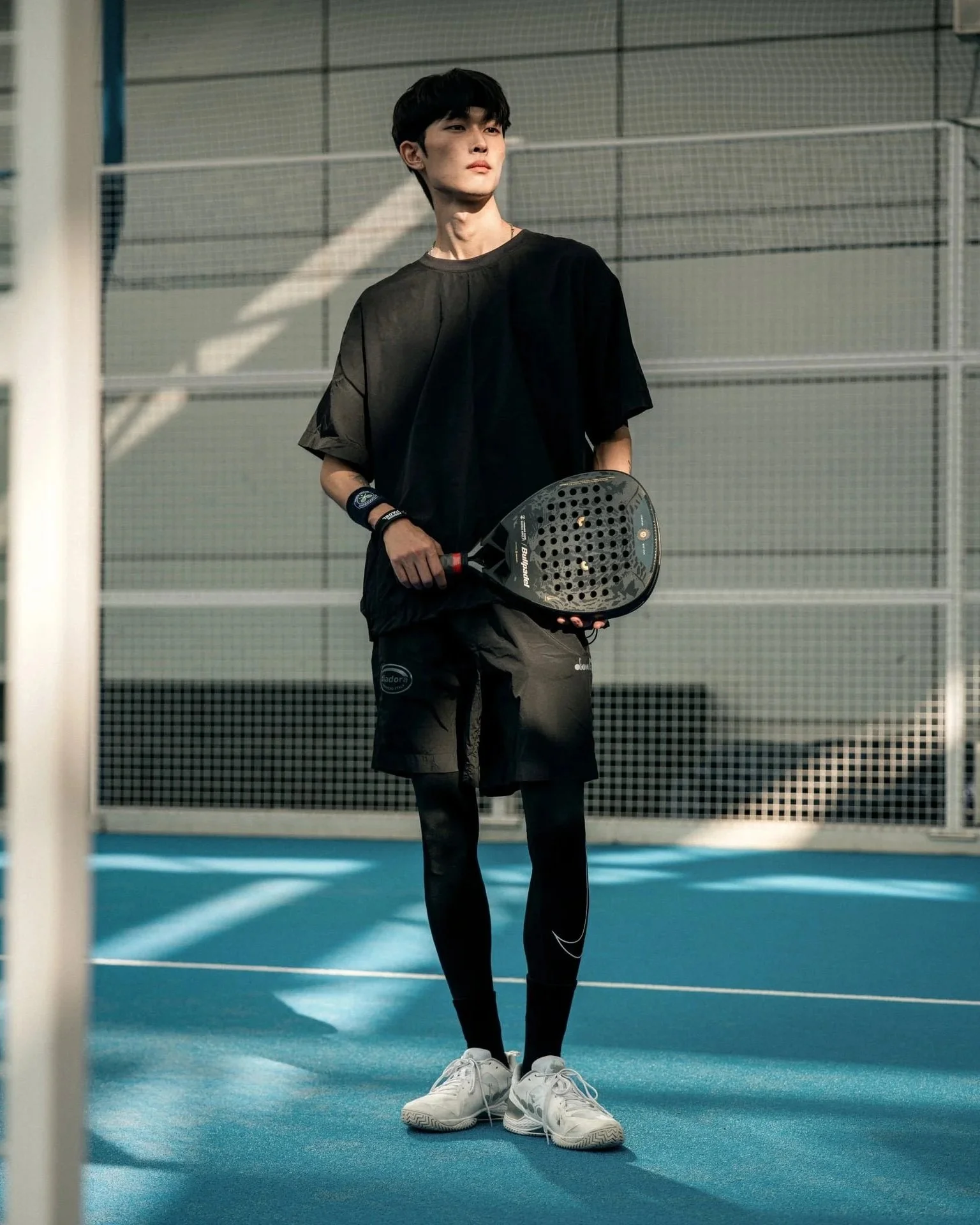 Padel lifestyle photography Seoul Korea — male model HEAD sportswear indoor court