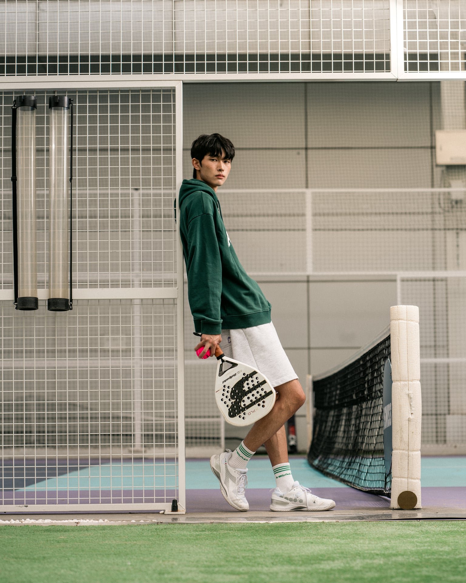 Commercial lifestyle photographer Seoul — male model padel indoor court Korea