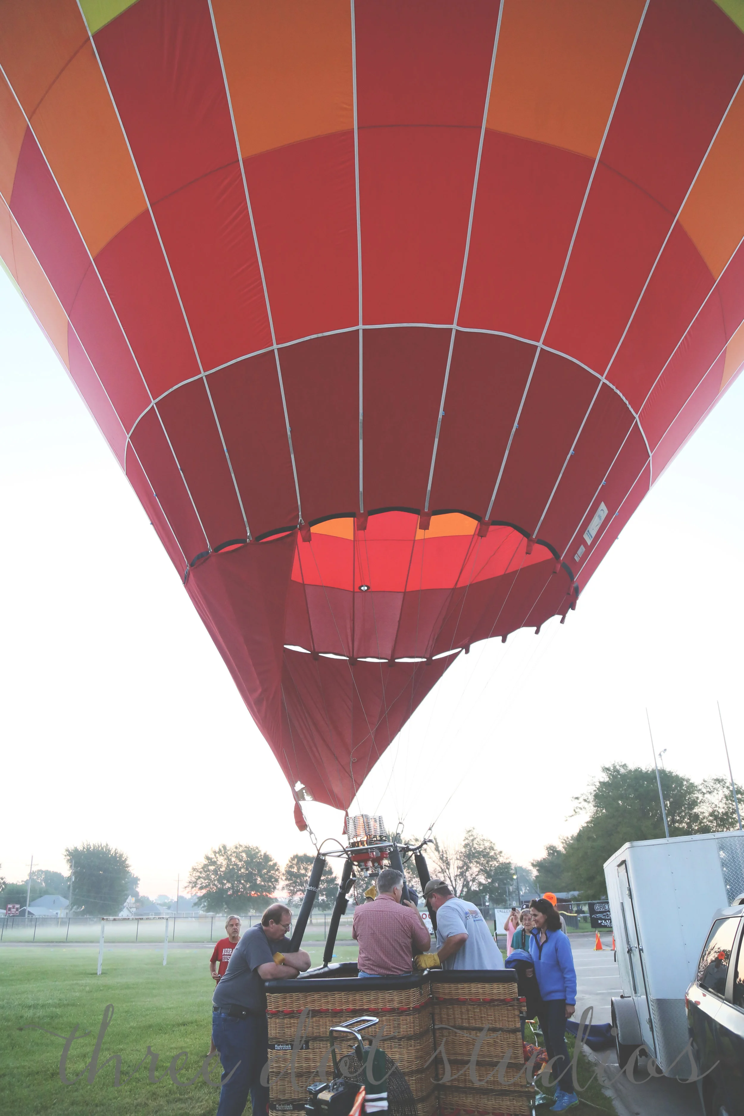 Because my dad is a 6'3" bear, they used him to ensure that the balloon didn't fly away. 