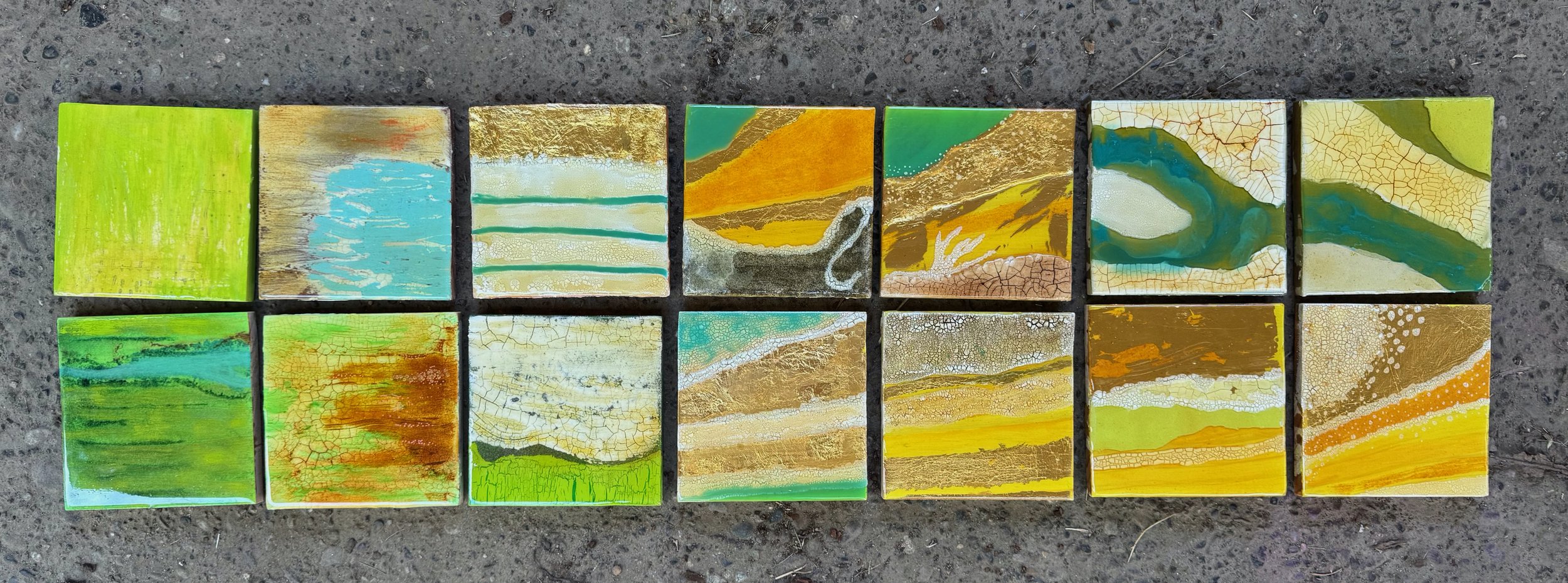 a series of 14 small pieces all small dissections of topographical studies represented on wood with acrylics, gold leaf and resin.