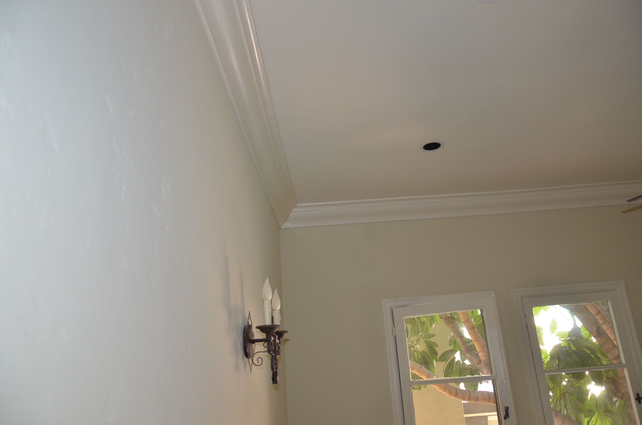 Crown moldings, recessed halogen lighting, architectural details. French doors out to a small private deck. Office/work-space.