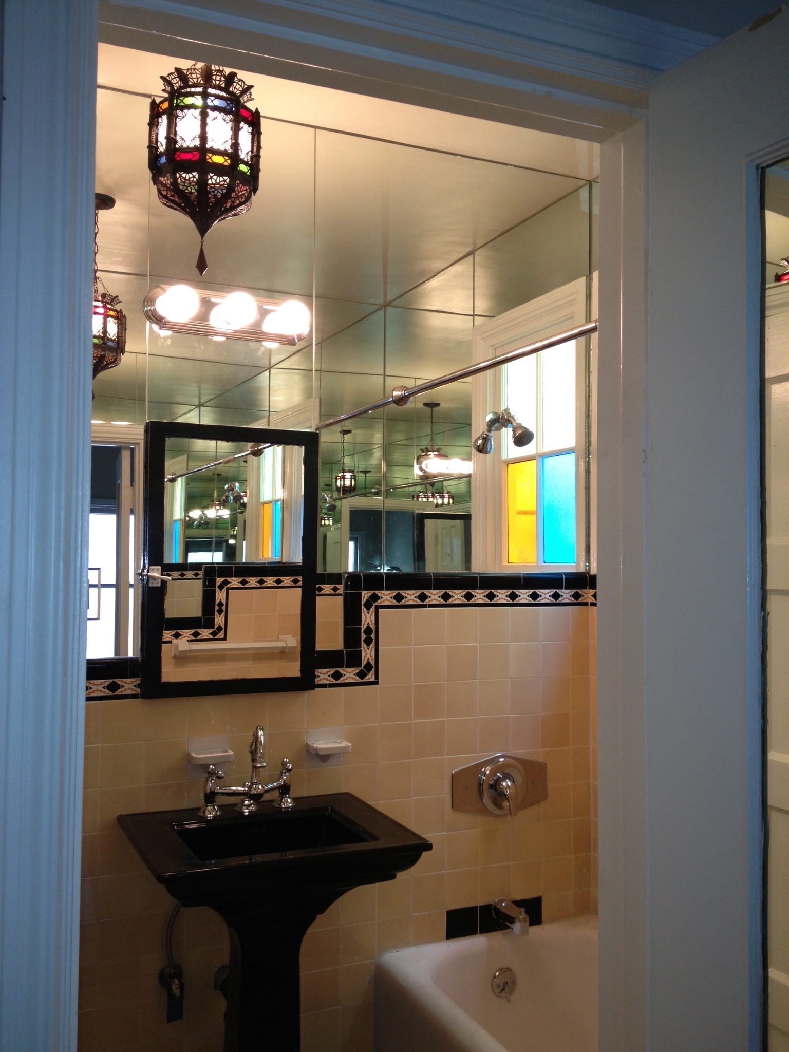 Near identical bathroom, but in lavender and black tile
