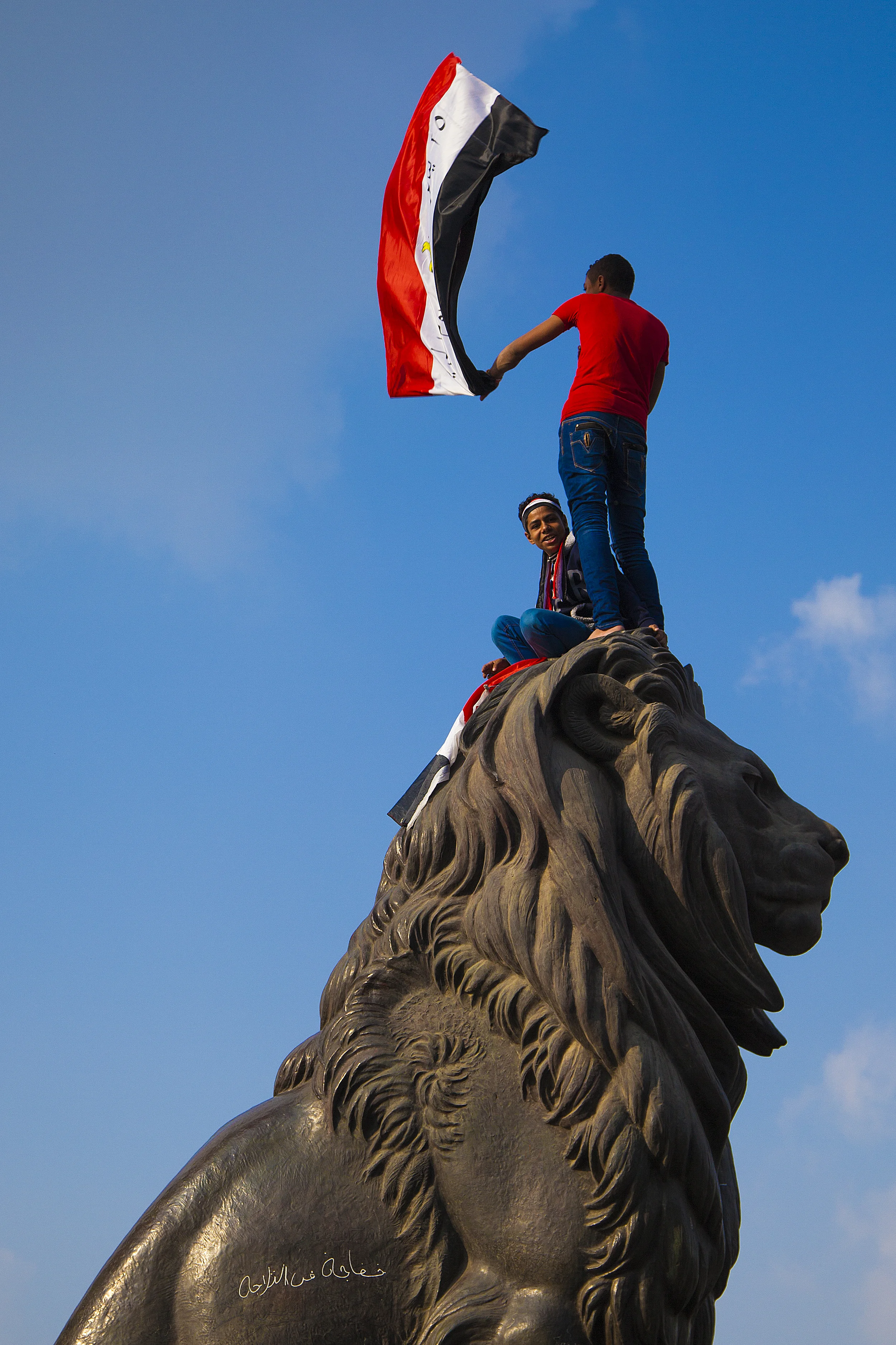 Young Egyptians on the Lion's Head. Tahrir.
