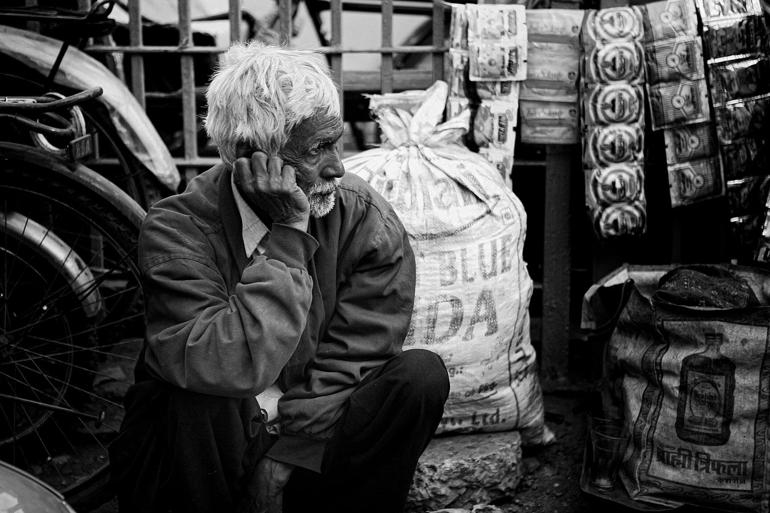 New Dehli Man Sitting at Bazaar.jpg