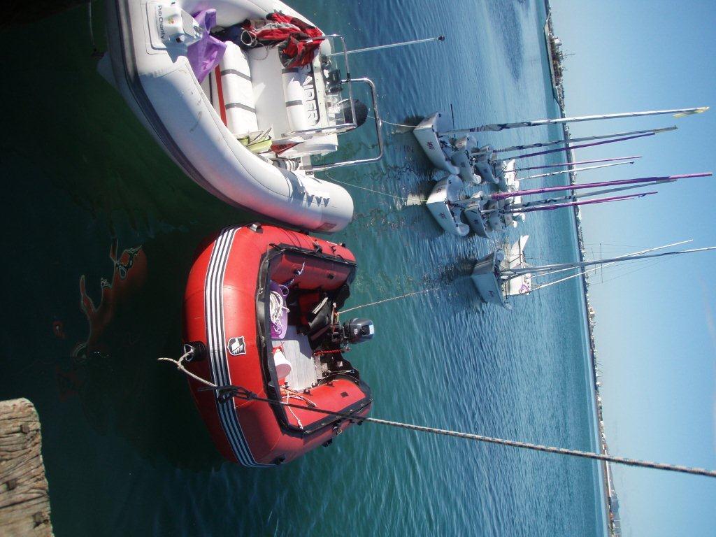 topaz and safety boats in tow at anchor.jpg