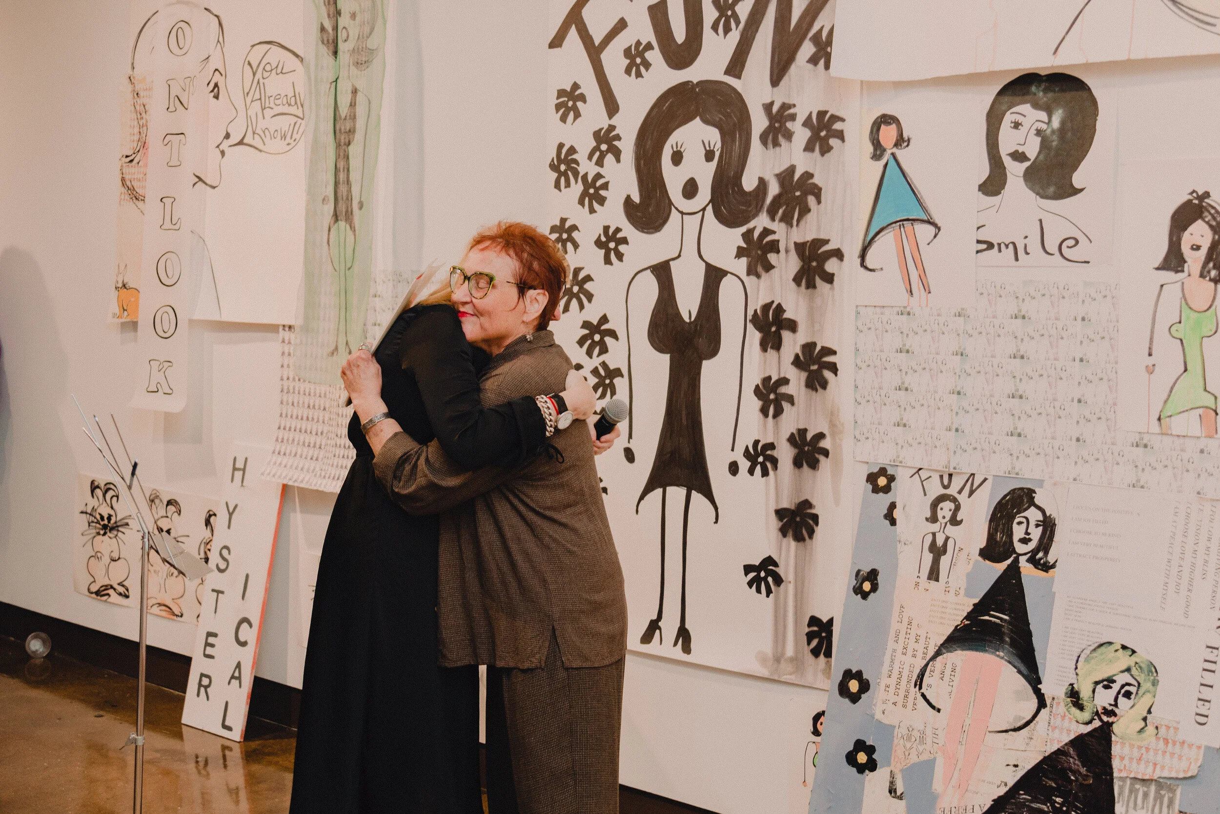 Debbie Millman hugs Pam Butler