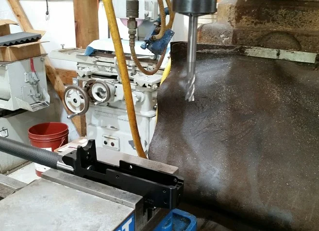 STEP-3: Remove Threaded Rear Tab and clamp 3/8” diameter Endmill (or flat bottom tool) into spindle. 3/8” Endmill should be long enough to clear pistol grip area of stock.