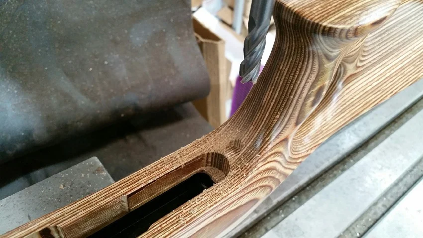 STEP-4: Attach the stock to the barreled-action using the front action screw. May need to shim the rear gap in between the stock and receiver to prevent the stock from pushing down and flexing during cutting. Using the 3/8” diameter endmill, carefully cut a full flat bottom into the stock.