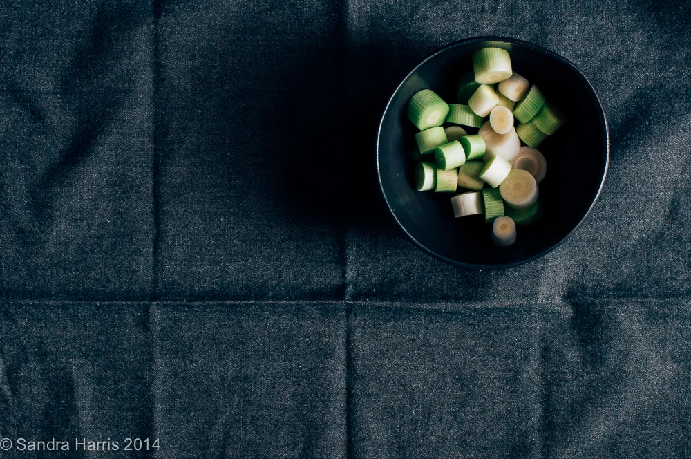 shallots in a black bowl - Sandra Harris