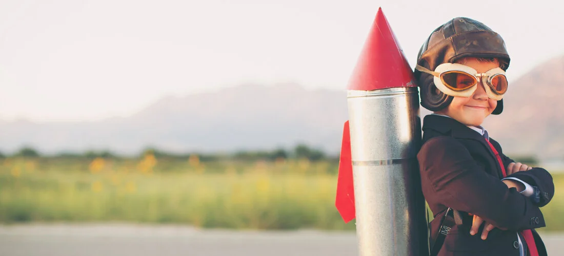 young-business-boy-with-rocket-on-back-kickoff-launch-medium-hero.jpg