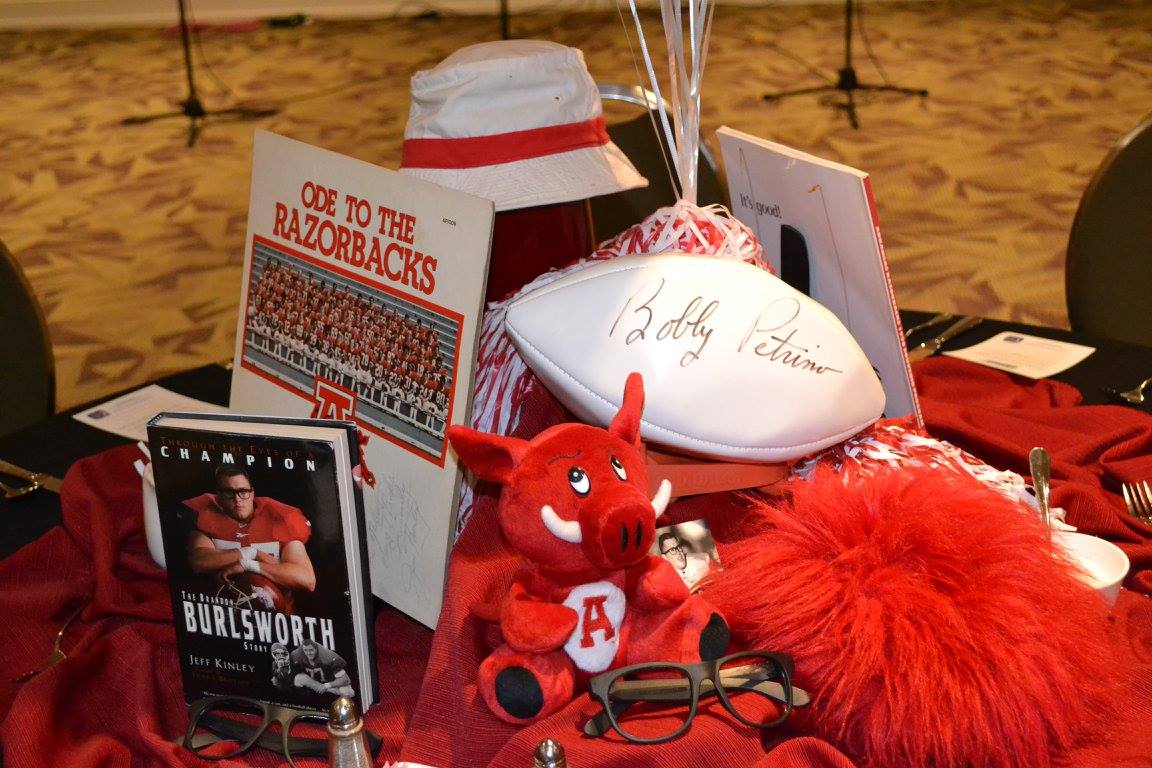 The date of the event coincidentally was the five year anniversary of the motorcycle incident of the coach who signed the above football. If you look closely at the "Ode to the Razorbacks" vinyl record, one of the players is wearing #12. He was the first and only player to wear the number since 1950. The team's only other retired number is Burlsworth's #77, which the school retired on the first home game after his death in 1999.