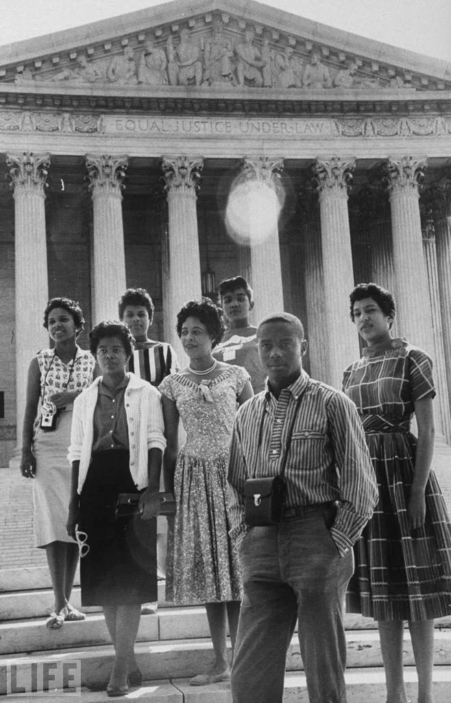 Daisy Bates (center) posing in front of the U.S. Supreme Court building with six of the nine African American students who integrated Little Rock (Central) High School. Represented by Mr. Carter and Pine Bluff, Arkansas native George Howard, Jr. , Bates would later successfully challenge Little Rock and North Little Rock ordinances that demanded city officials be provided with a list of names of the members of the local branch of the NAACP. The U.S. Supreme Court held the ordinances unconstitutionally infringed on the freedom of association. See Bates v. City of Little Rock , 361 U.S. 516, 80 S. Ct. 412, 4 L. Ed. 2d 480 (1960) .