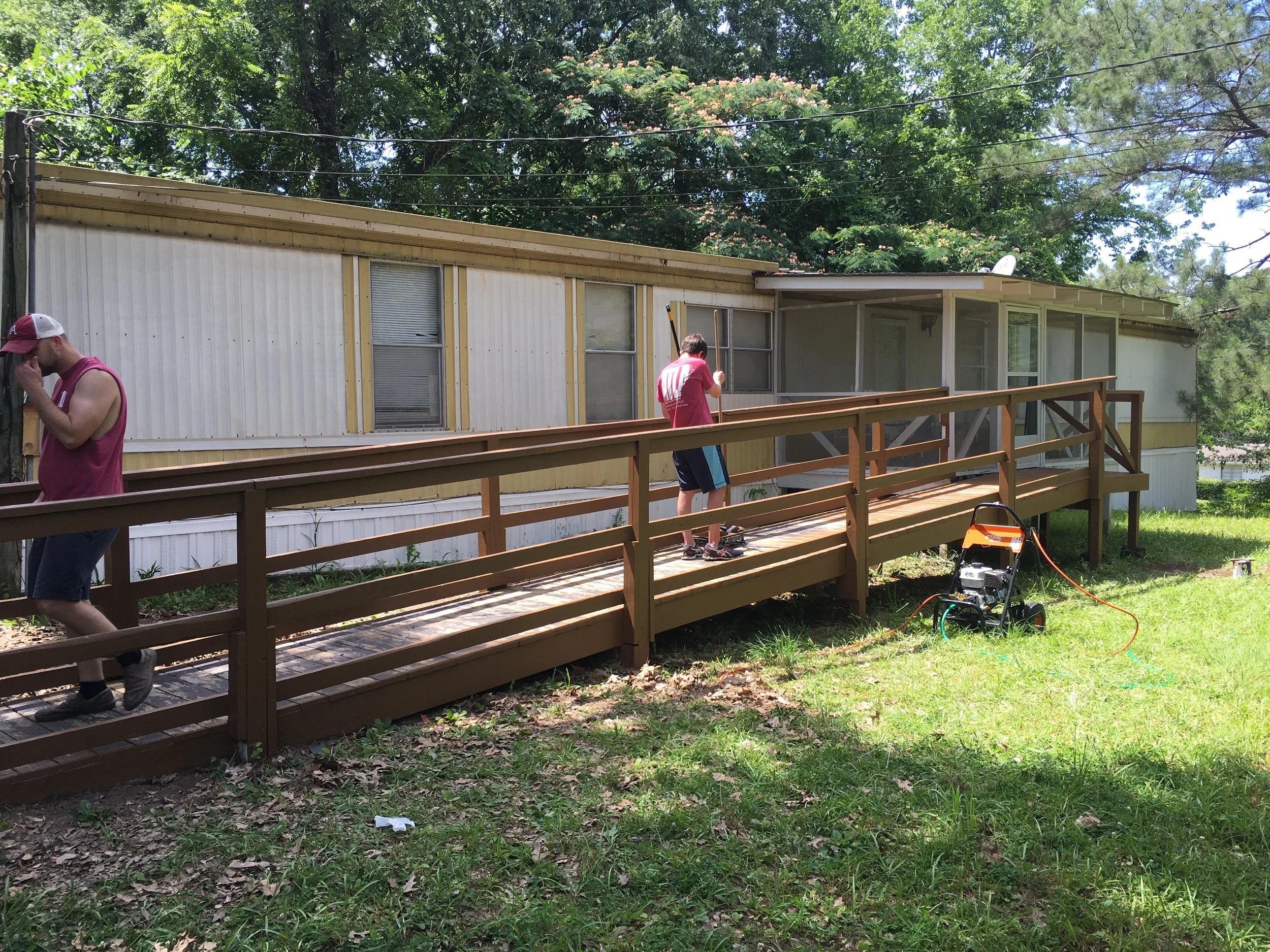 Pictured above are Jay Neal (left) and Austin King (right) finishing up the paint job.