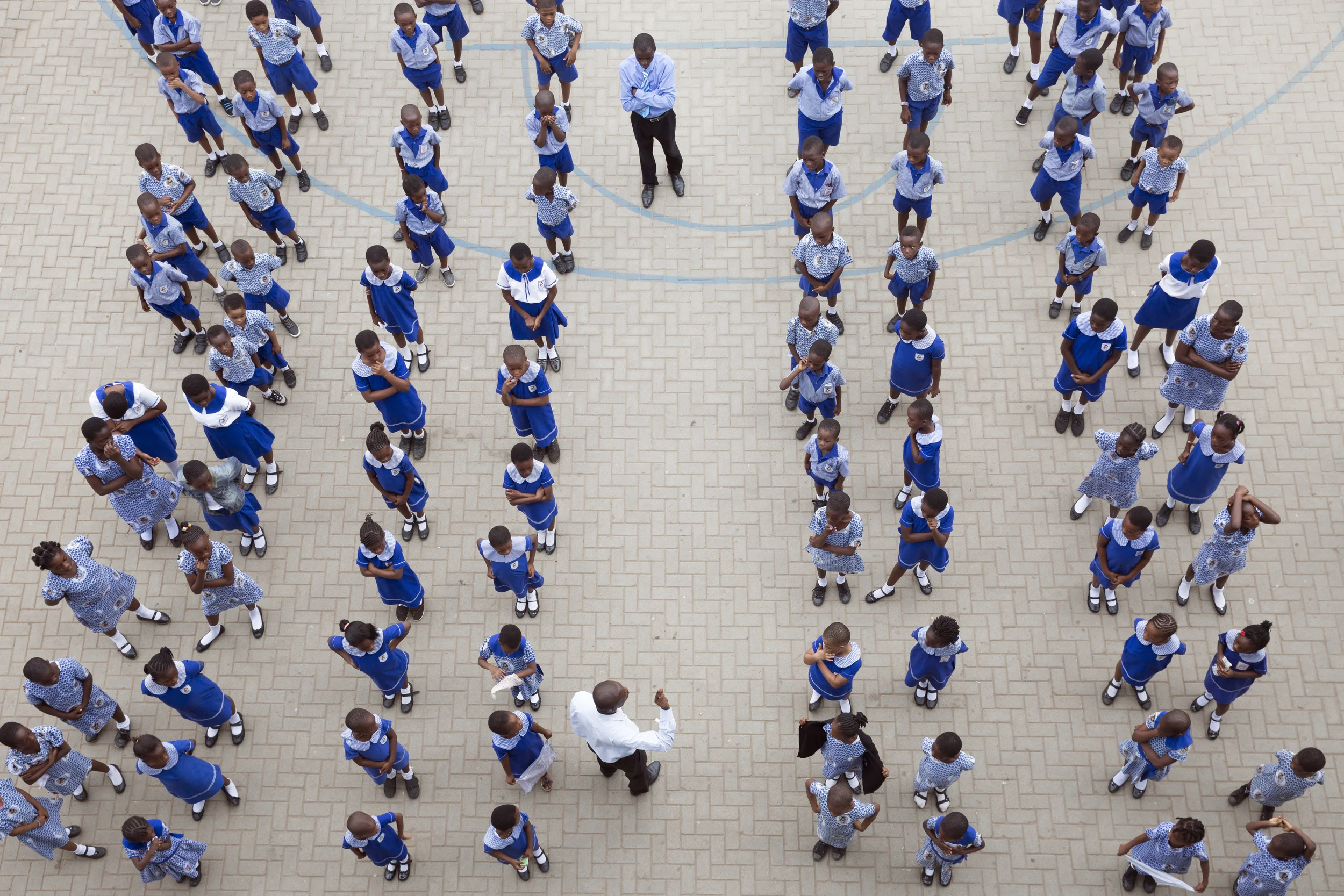 Brainbirds students (not all included) line up in their uniforms for their morning assembly.