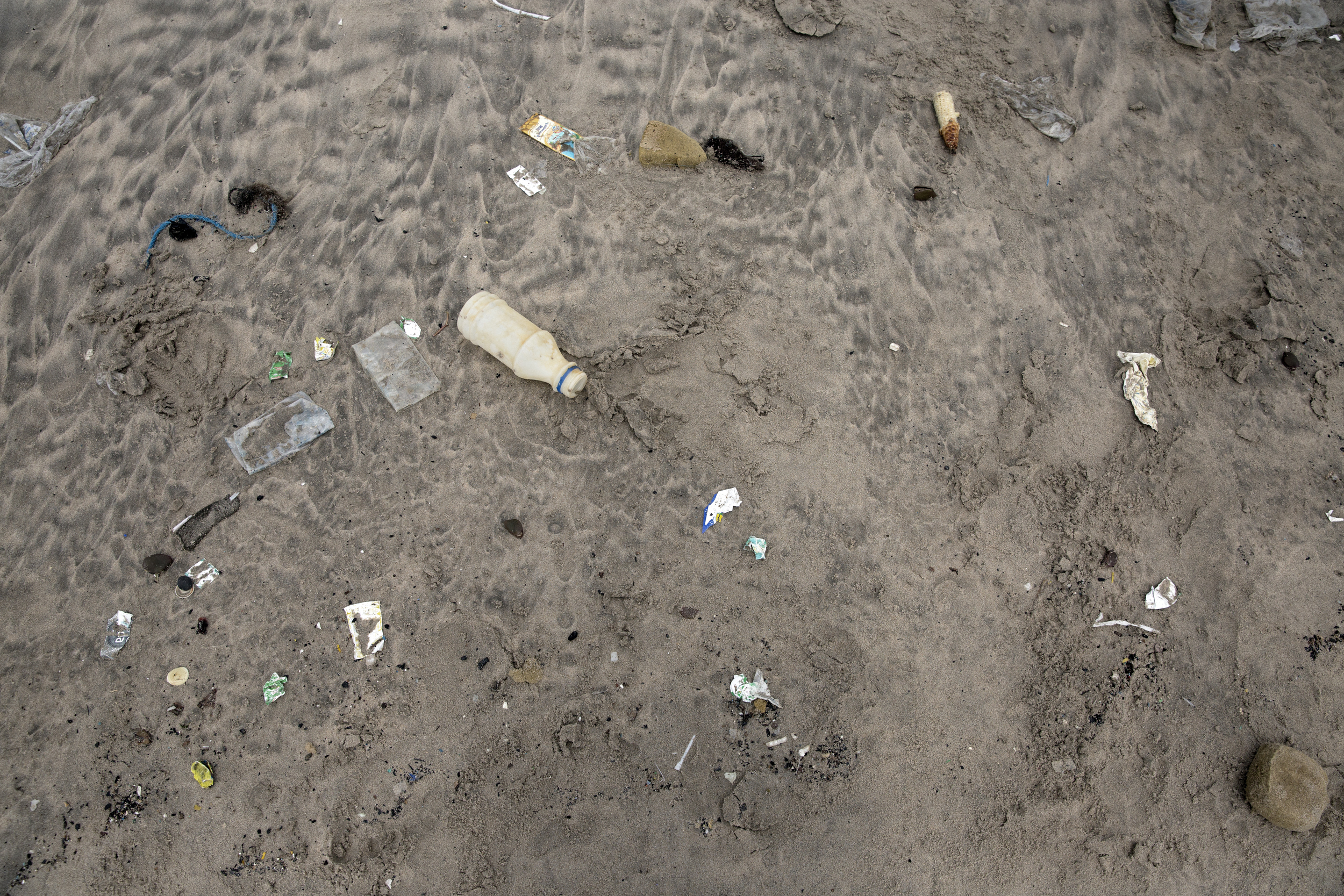 Trash was all over the beach (I'm guessing because a lot of people dispose of their trash in the gutters and rivers by their houses, and also because there are no trash cans available at the beach itself).