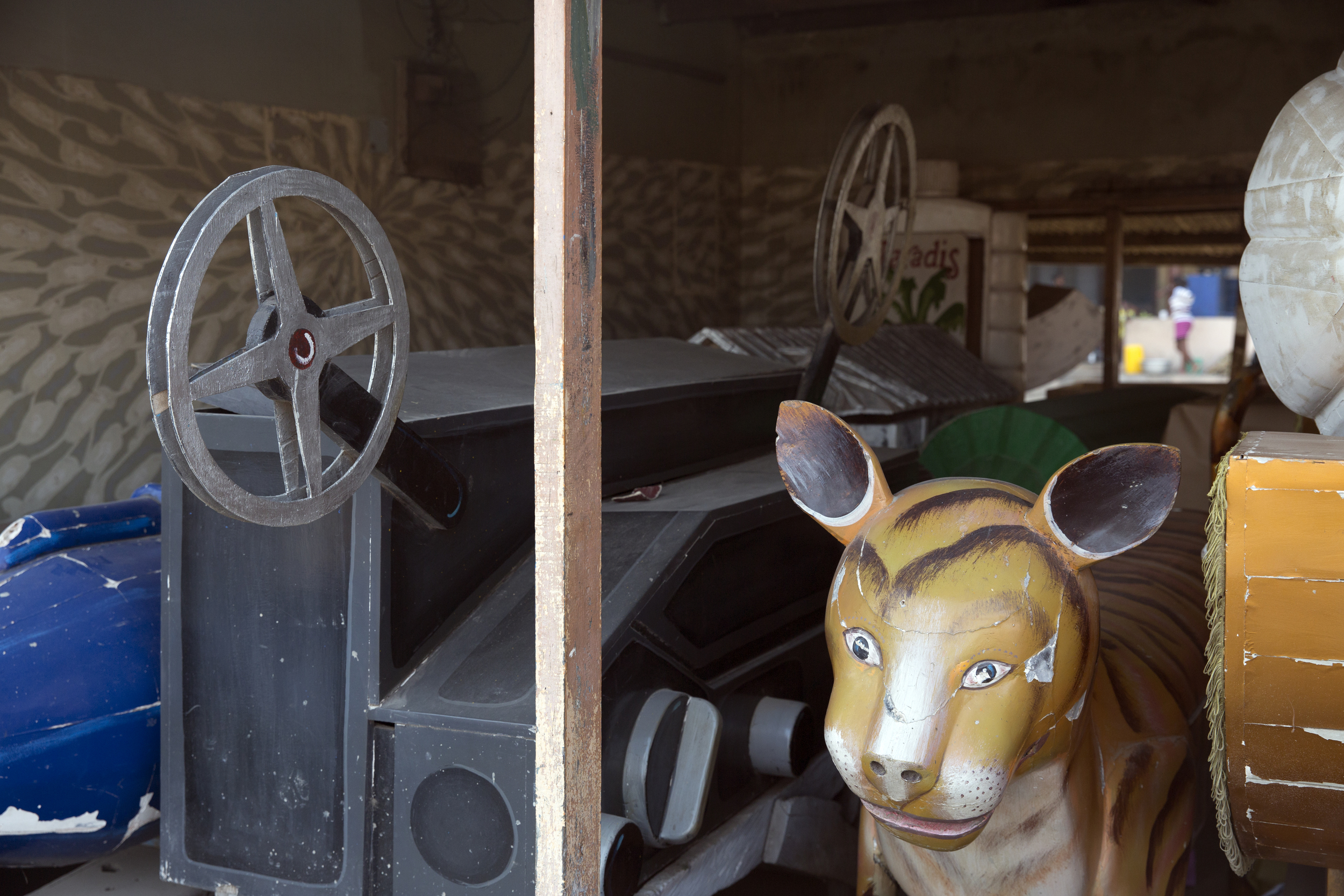 A video camera and tiger are featured amongst other strange coffin designs. 