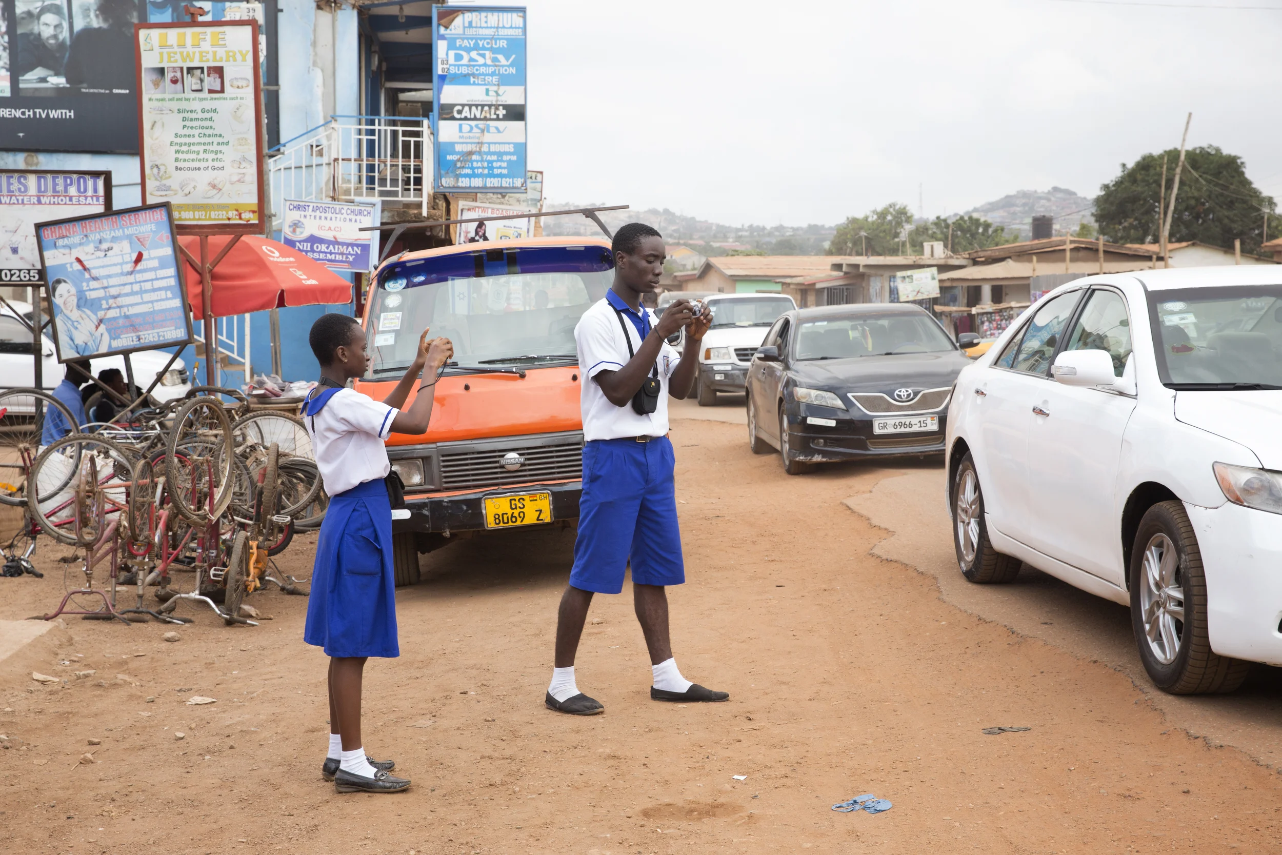 Hectoria and Joshua photograph Alhaji traffic.