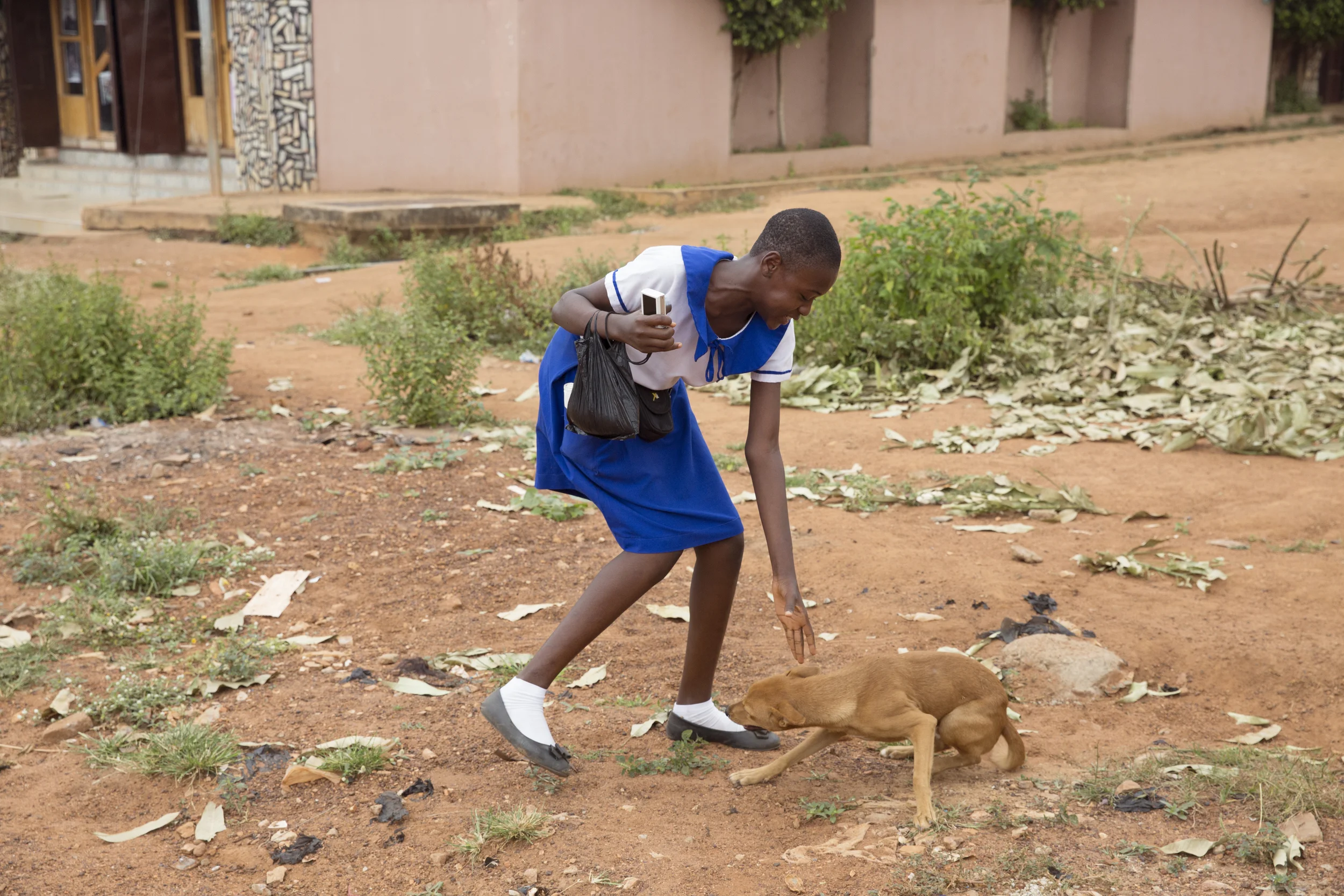 Eugenia plays with her dog (who can't understand why he isn't allowed to return back to the school with us).