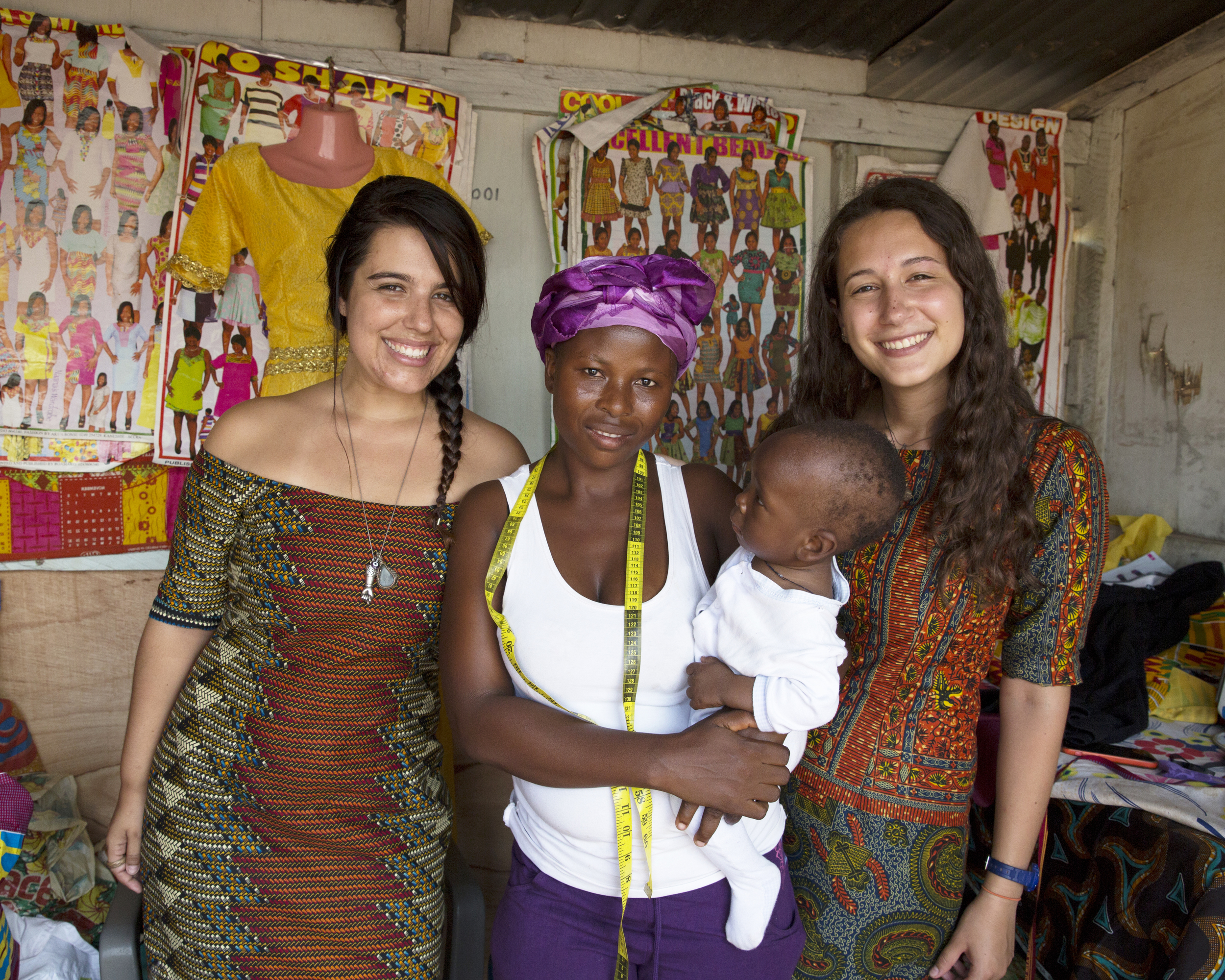 Mariana and I pose for a photo with Mary and her son while wearing our beautiful new dresses. 