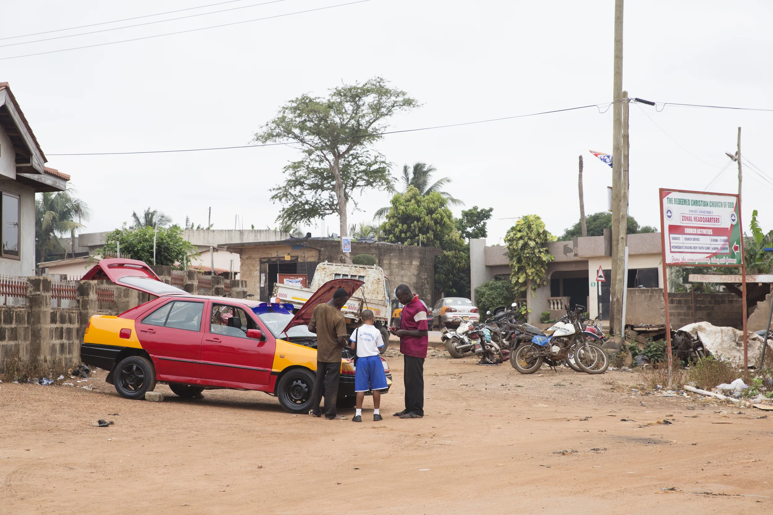 Perlin makes me proud during the caption assignment--approaching two men fixing a car and taking their photographs, all on his own! 
