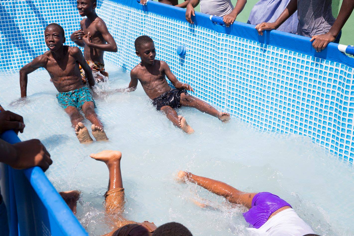 The kids "swim" in the pool. (I say "swim" because most of them don't actually know how, and so they just slosh around in the shallow water)