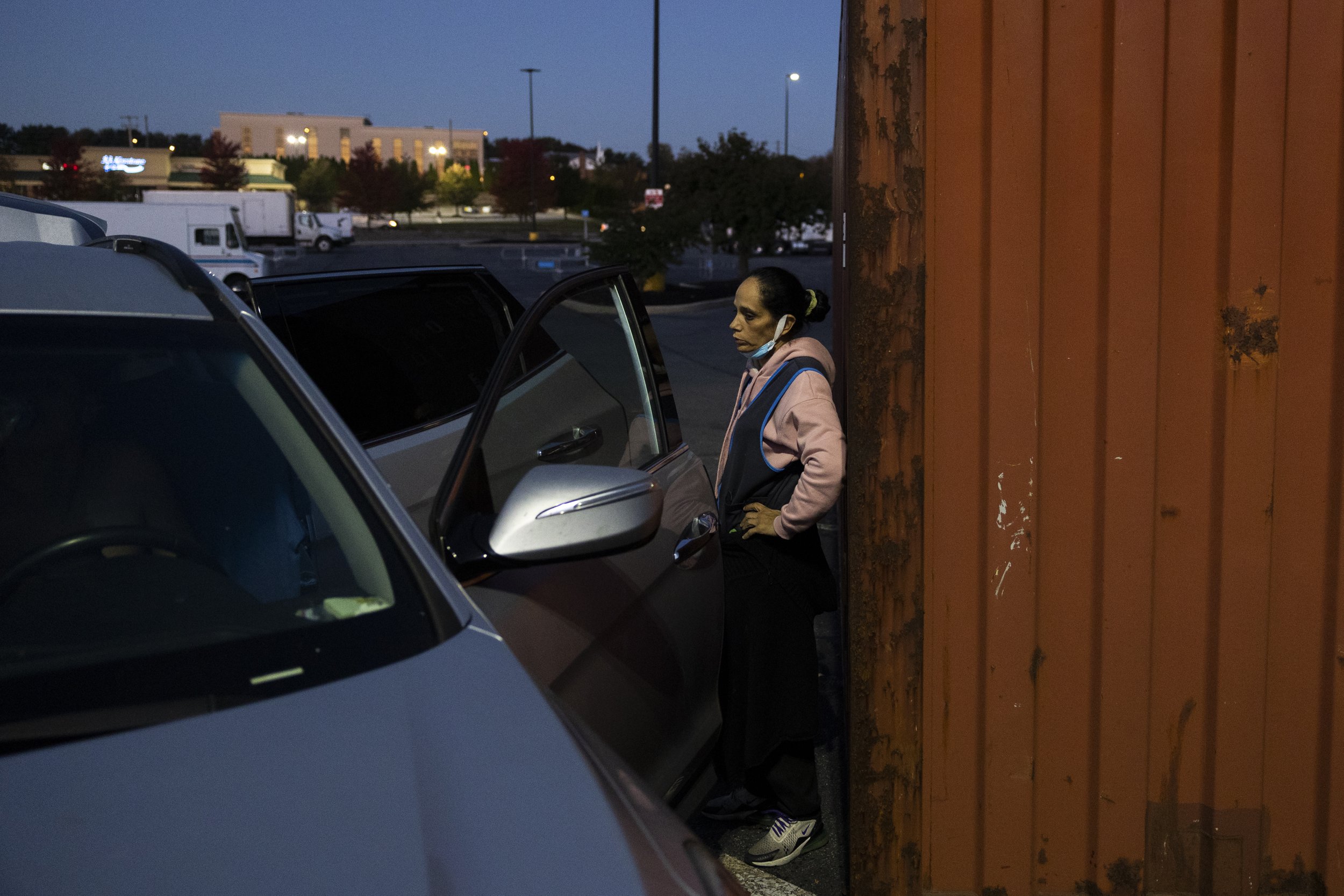  7:04AM: Veronica waits as her three boys get ready for school in the Walmart parking lot. 