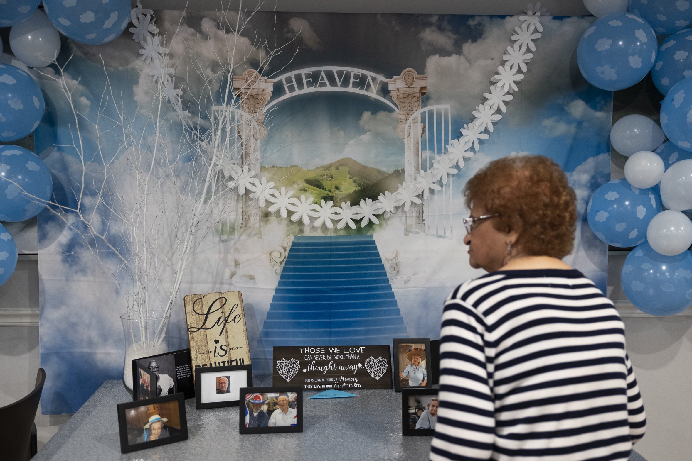  Pauline stops at the memorial set up to honor the Brandywine residents who died from COVID-19 on September 16, 2021. 