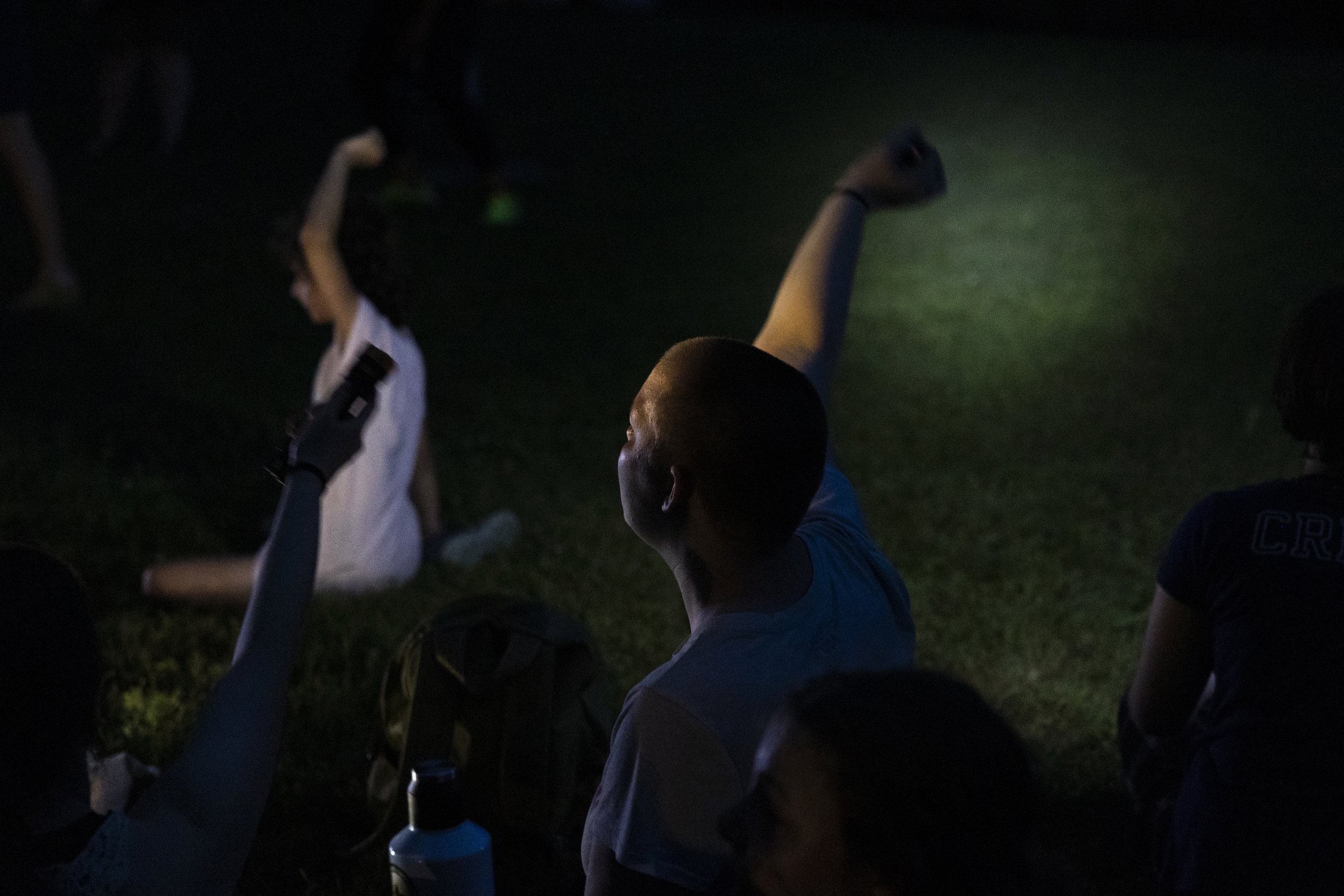  Campers wave their flashlights to the tune of “Take Me Home, Country Roads.” 