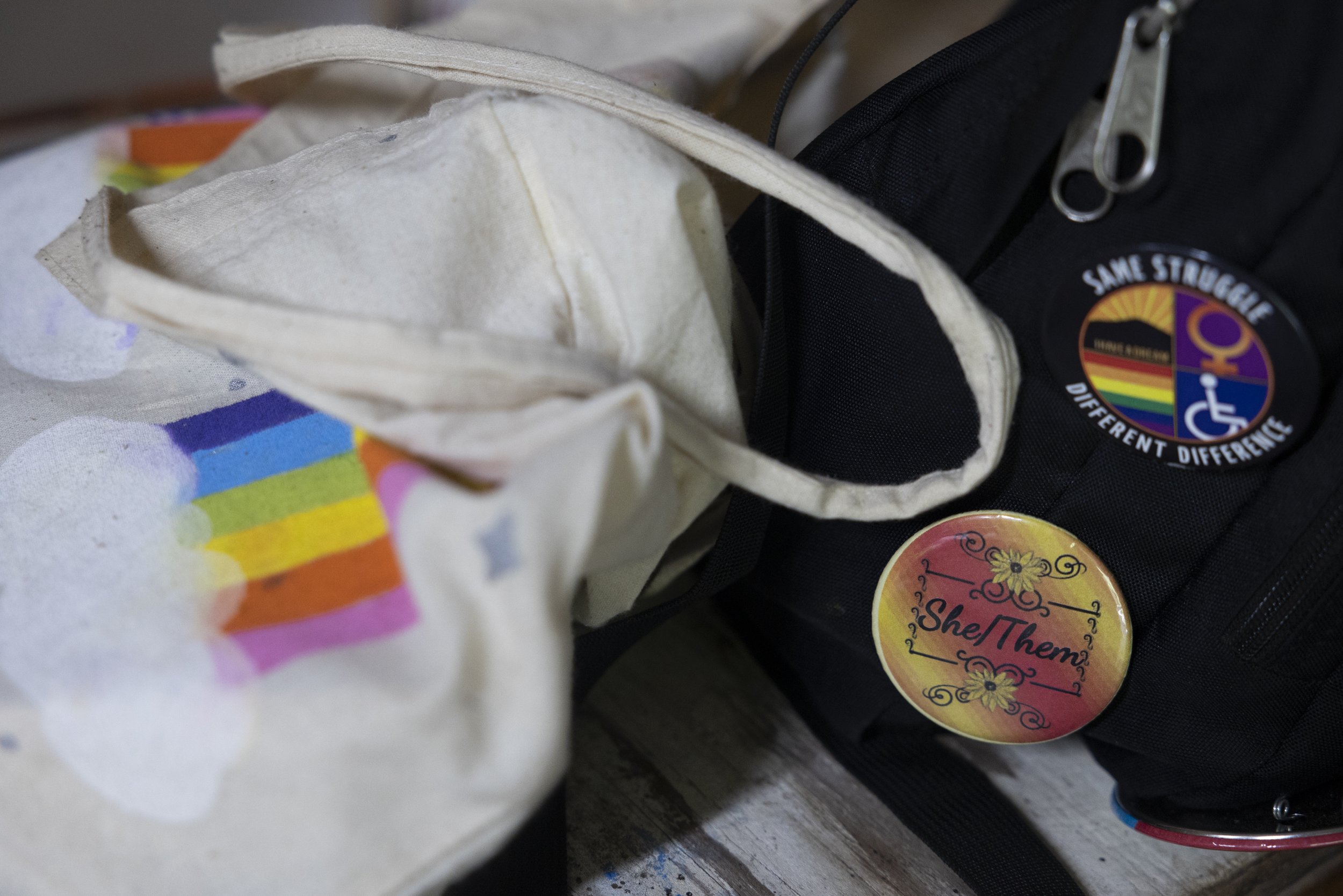  A camper’s backpack has a button which shows their pronouns: she/them. 