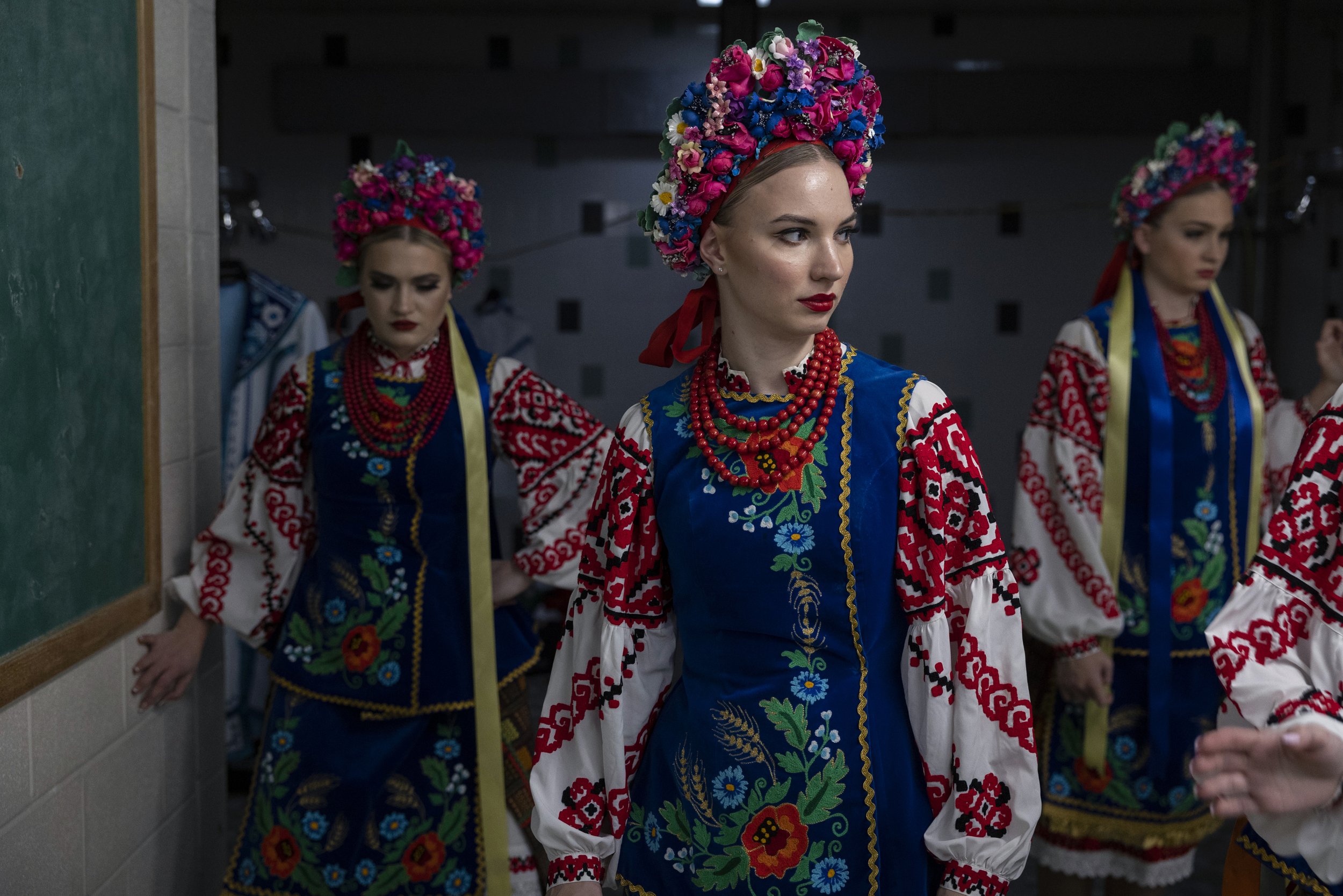  Dariya Medynska (center) gathers with other members of the Voloshky Ukrainian dance ensemble before the International Spring Festival at North Penn High School in Lansdale, Pennsylvania on April 23, 2022. (On assignment for NPR) 