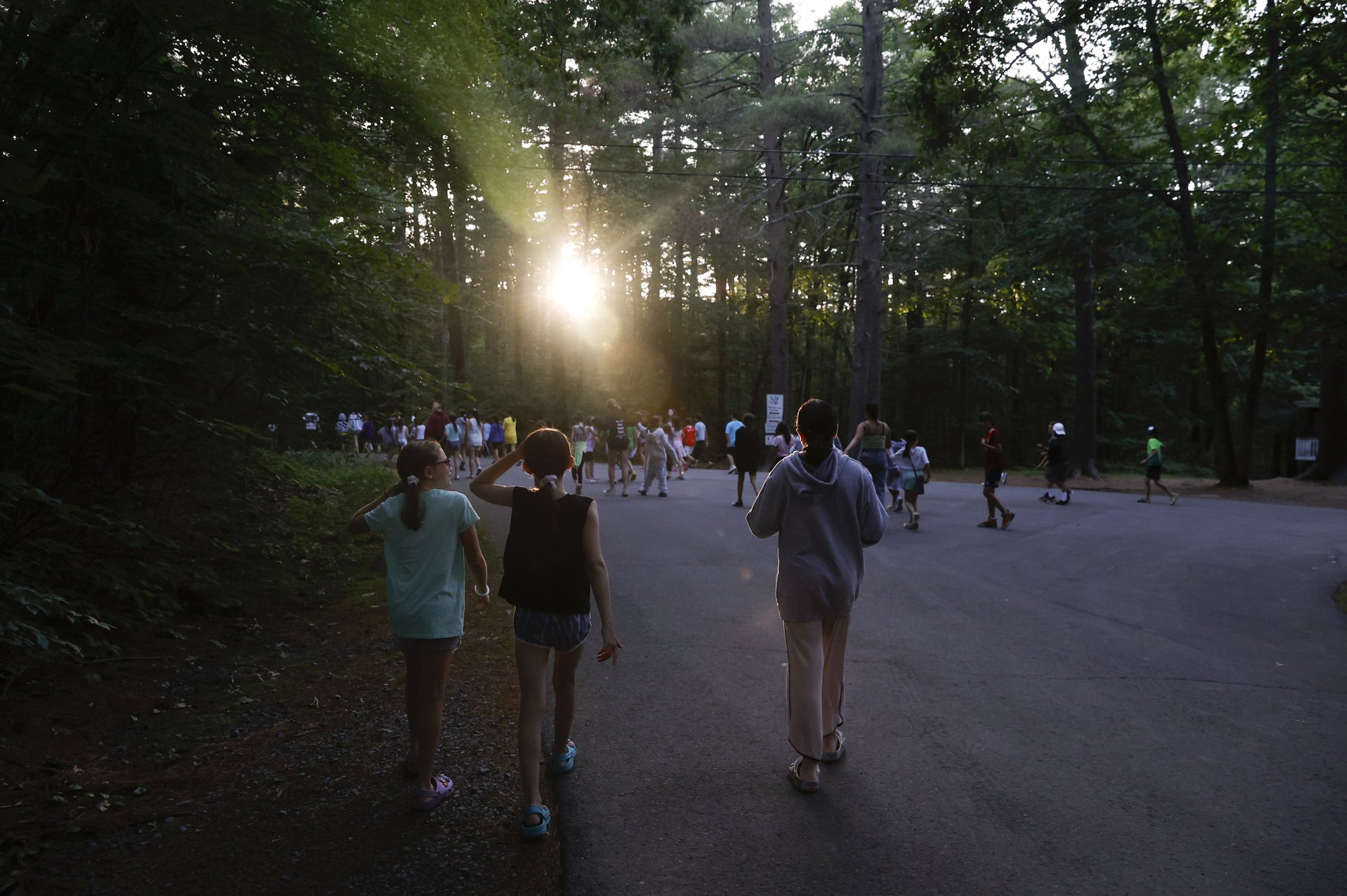  (From left) Eliza Goodman, Sari Lampert, and Amelia Goldin walk to evening programming on July 10, 2021.  