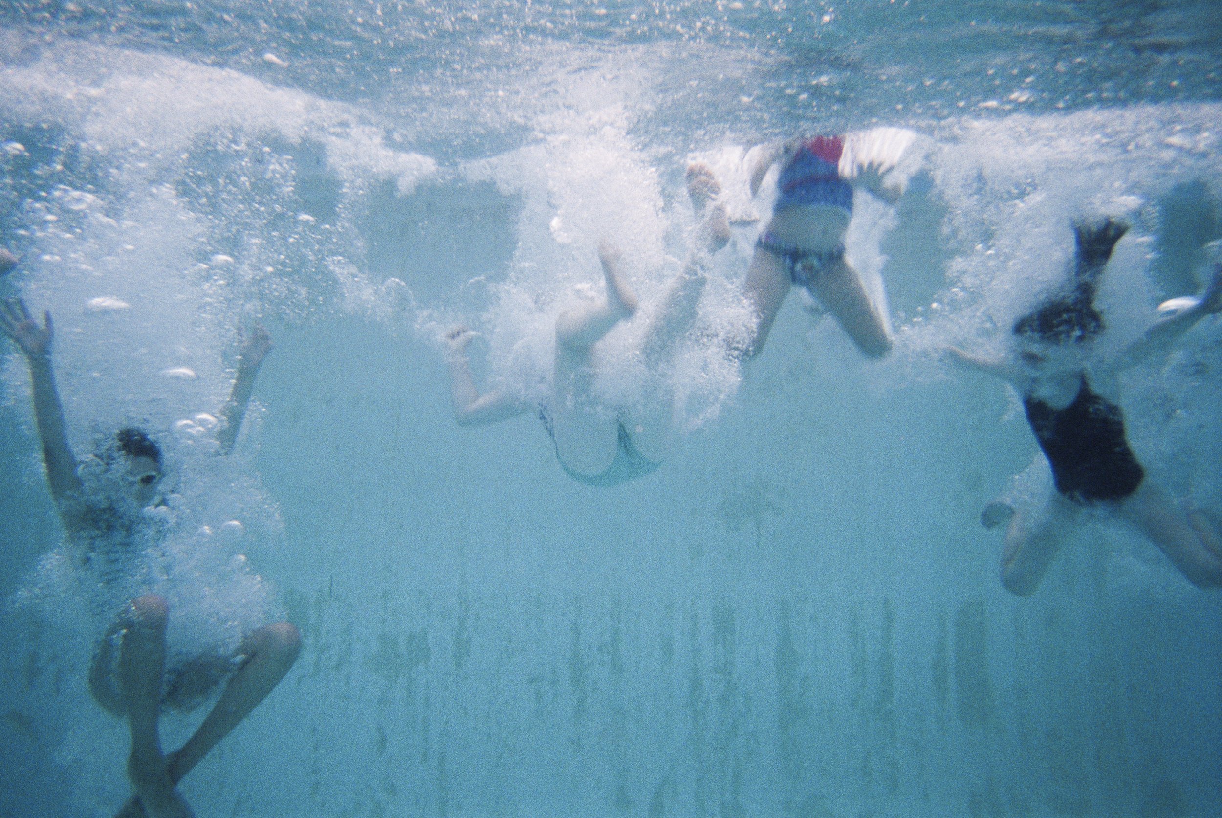  (From left) Sadie Shvetz, Amelia Goldin, Morgan Bloomfield, and Sari Lampert jump into the pool on July 27, 2021.  