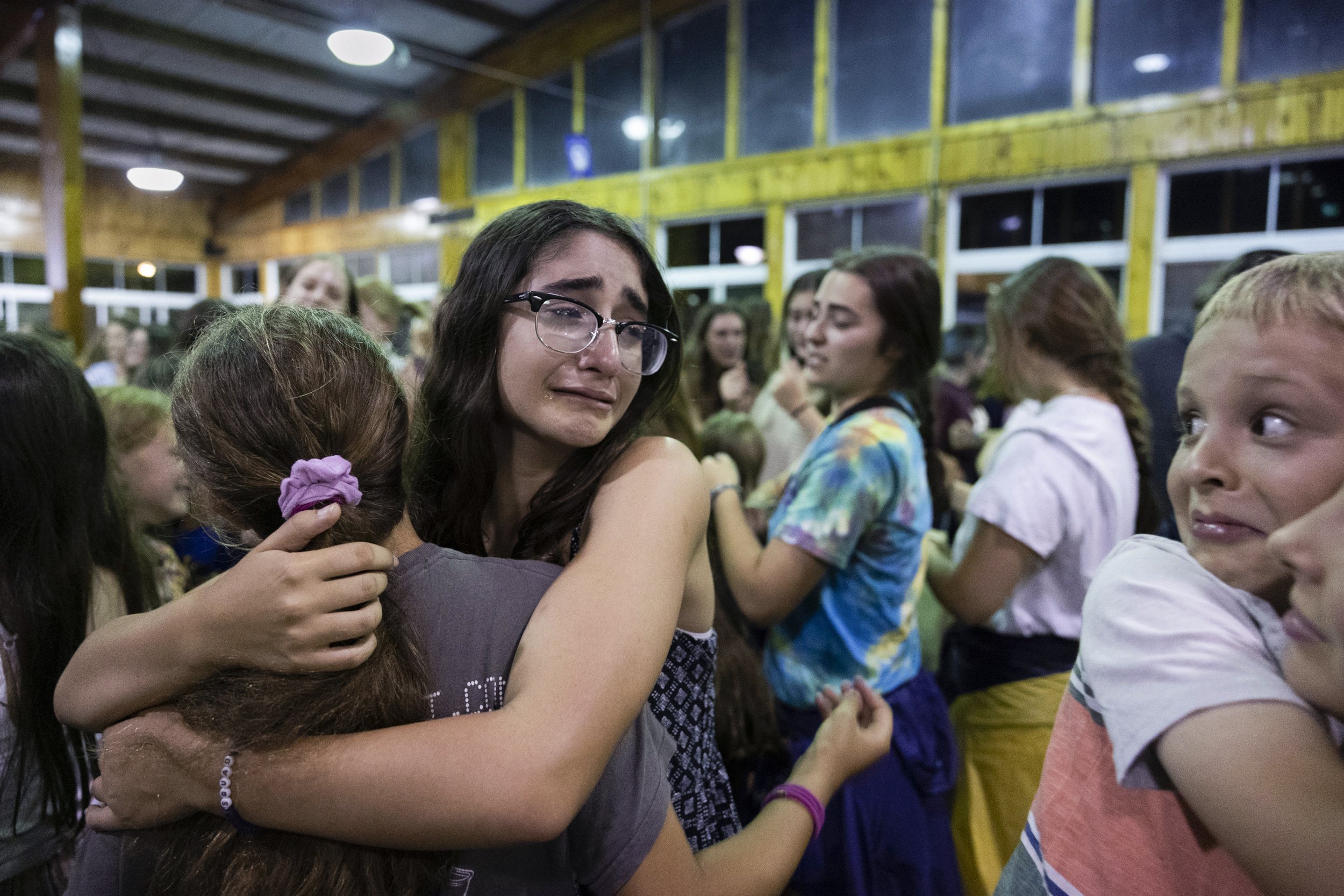  Daniella Goldberg (left) cries as she says goodbye to her  friends on the second to last day of camp on July 24, 2022. 