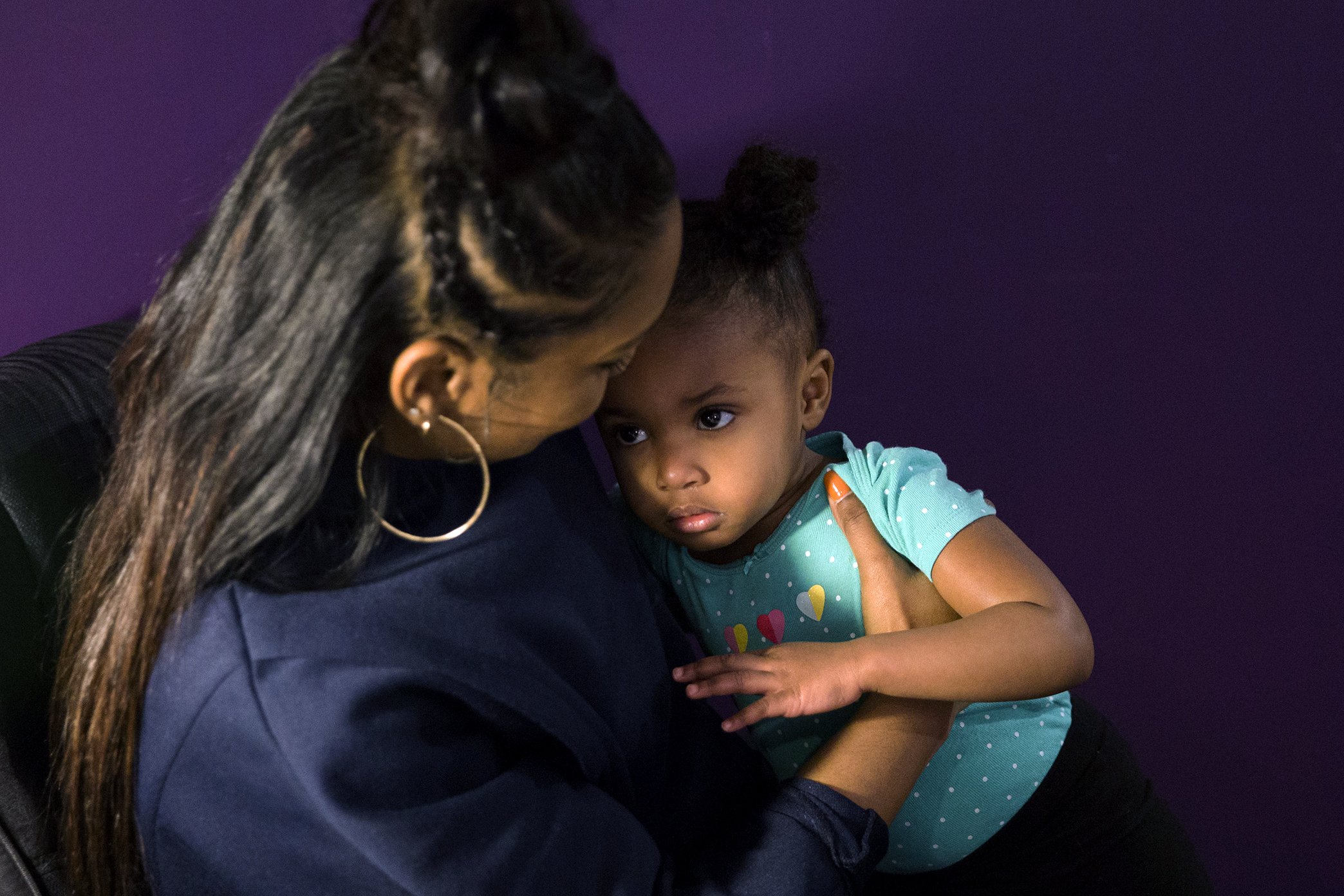  Midwife Asasiya Muhammad (left) hugs two year old Annalulu Ndanu in her office at Inner Circle Midwifery on February 9, 2019. Muhammad delivered Ndanu two years ago and is now affectionately referred to as "Auntie Asasiya" by Ndanu and her siblings.