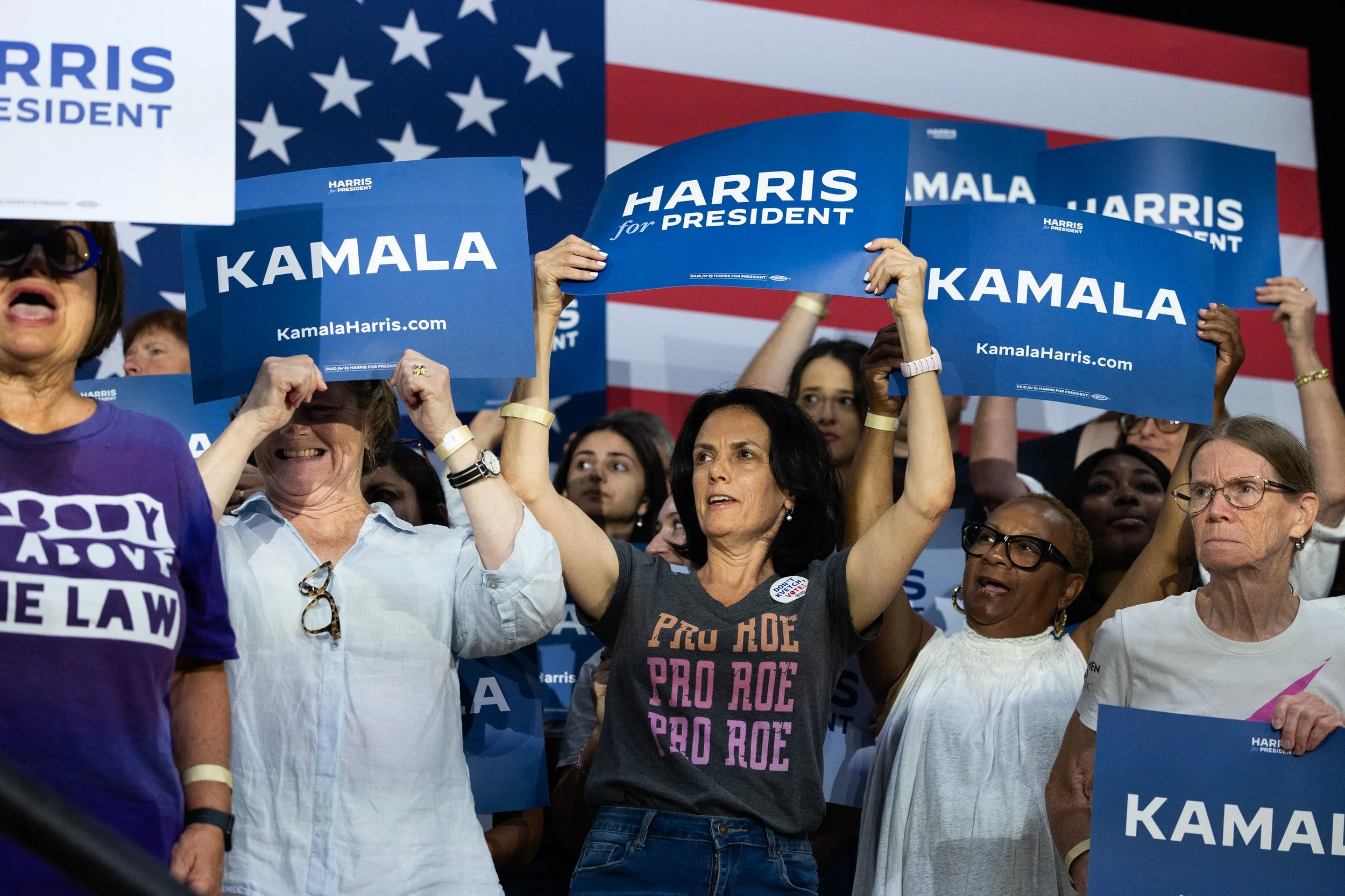  Fans hold signs in support of U.S. Vice President Kamala Harris’ Democratic presidential election campaign in Ambler, Pennsylvania on July 29, 2024. (On assignment for Reuters) 