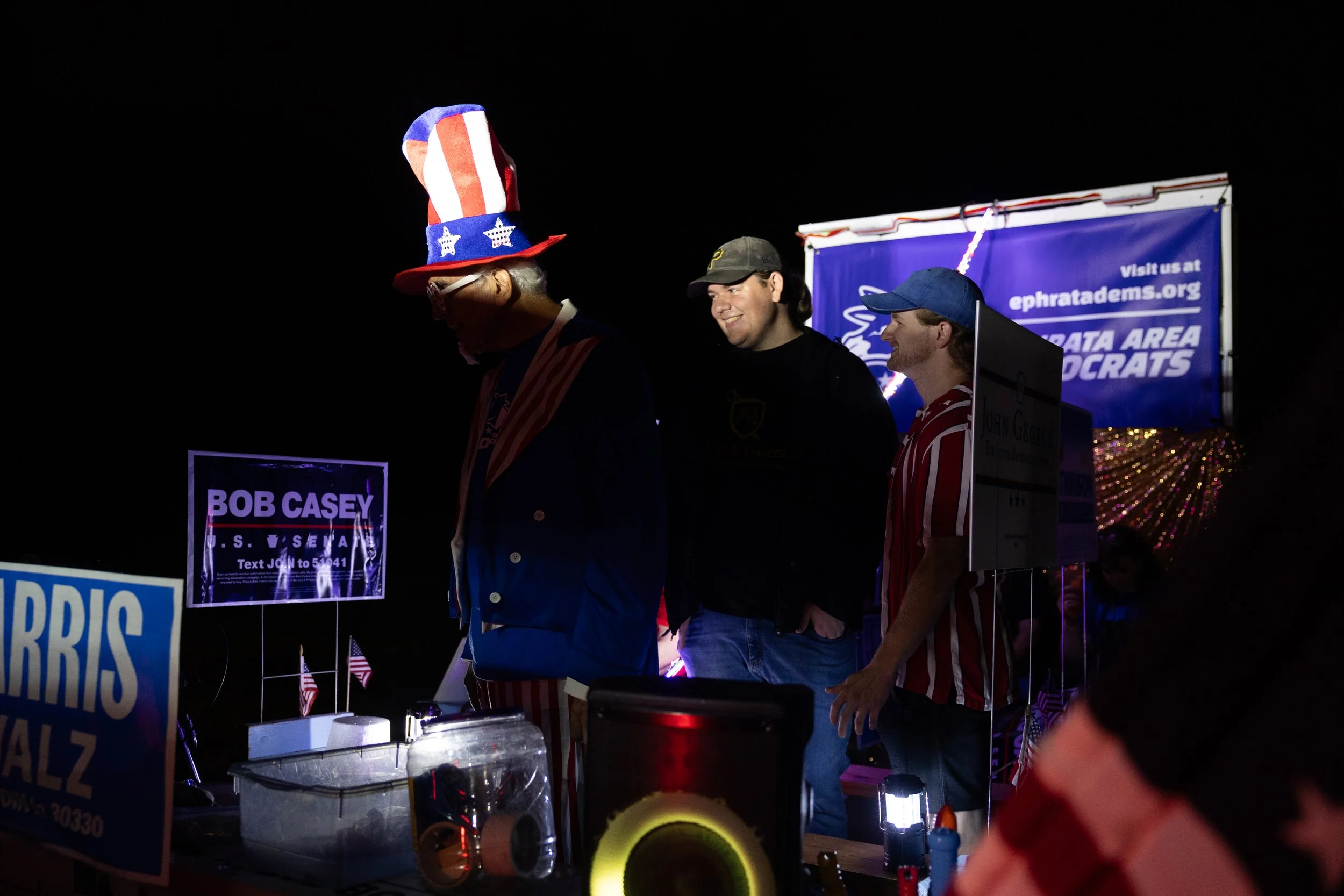 George Di Illio and Chandler Eby prepare to ride on the float shared by the Ephrata Area Democrats and Lancaster County Democrats in a parade in Ephrata, Pennsylvania on September 25, 2024. (On assignment for the New York Times) 