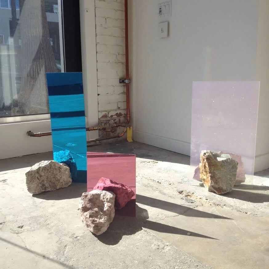 installation of artist work onsite materials: plexiglass and rocks