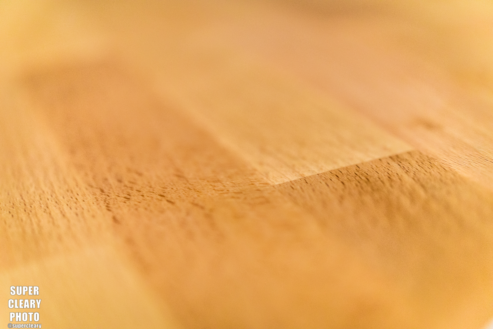 The work surface material is a hearty wood with a nice sand on it.
